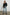 Lindi Long-Sleeve V Neck Cardigan with Three Button Closure, Two Front Patch Pockets and Ribbed Trim in Black Colorway - Front Full Body View Featured on Model