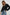 Lindi Long-Sleeve V Neck Cardigan with Three Button Closure, Two Front Patch Pockets and Ribbed Trim in Black Colorway - Front View Featured on Model