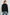 Lindi Long-Sleeve V Neck Cardigan with Three Button Closure, Two Front Patch Pockets and Ribbed Trim in Black Colorway - Back View Featured on Model
