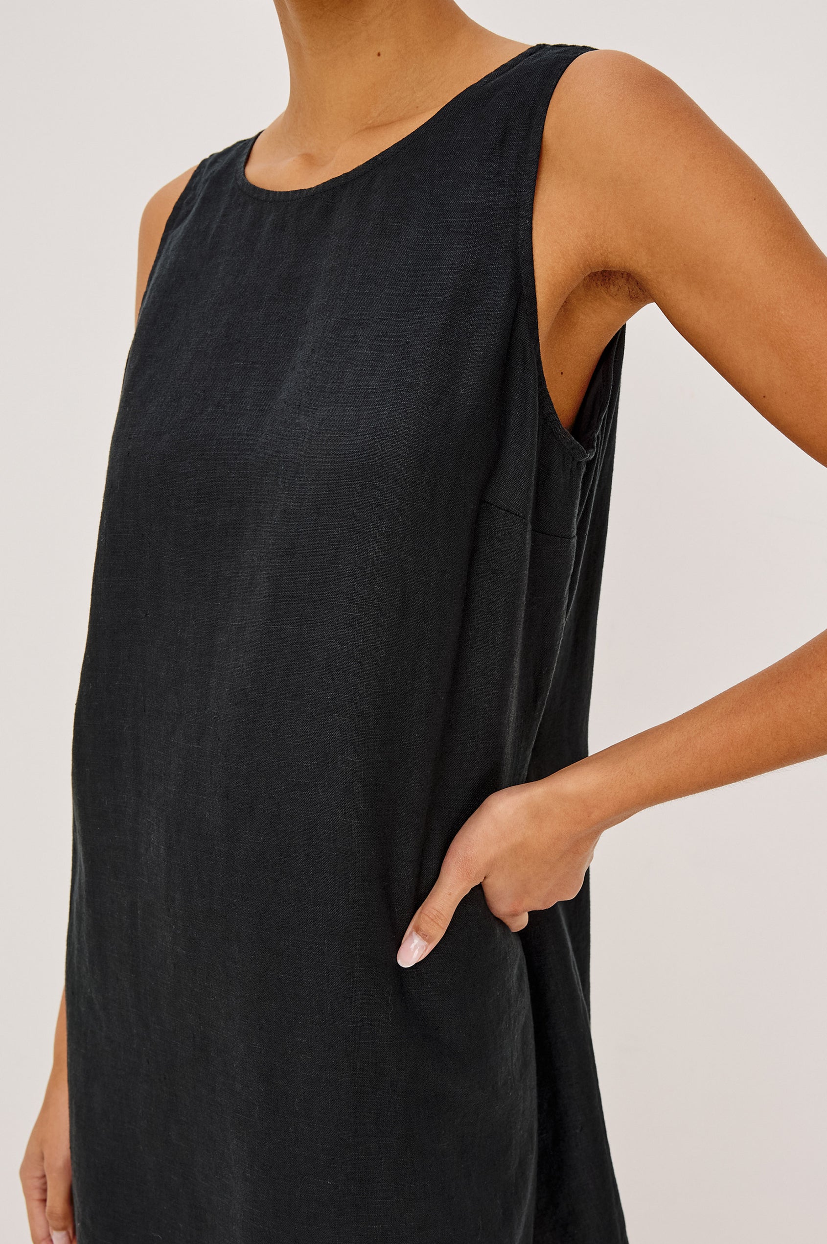 Lindsey Sleeveless Scoop Neck Mini Dress in Black Colorway. Front View Shown on Model.