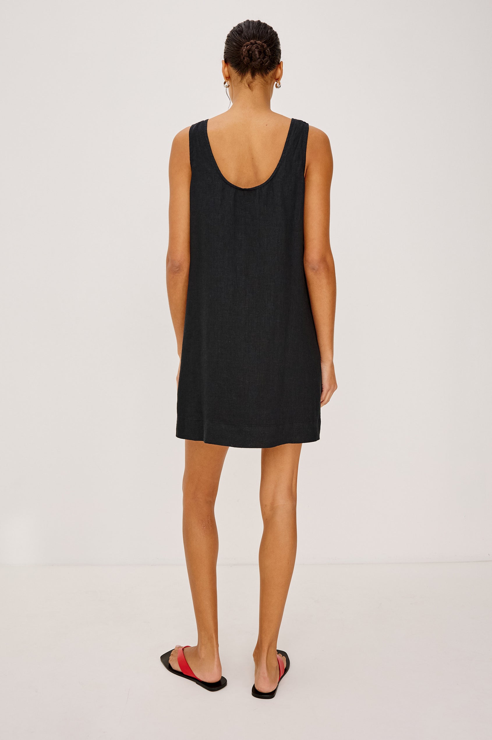 Lindsey Sleeveless Scoop Neck Mini Dress in Black Colorway. Front View Shown on Model.