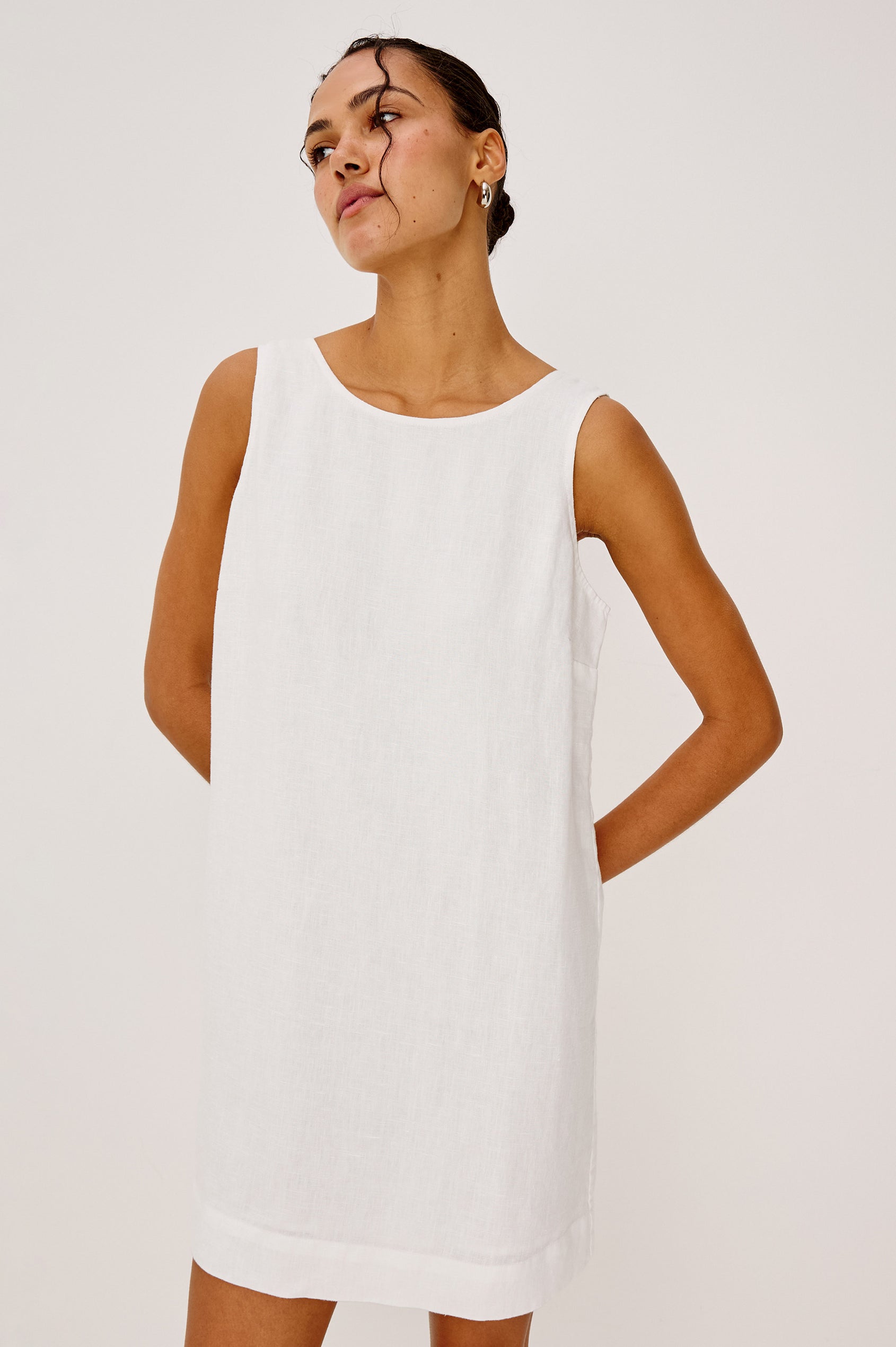 Lindsey Sleeveless Scoop Neck Mini Dress in White Colorway. Front View Shown on Model.