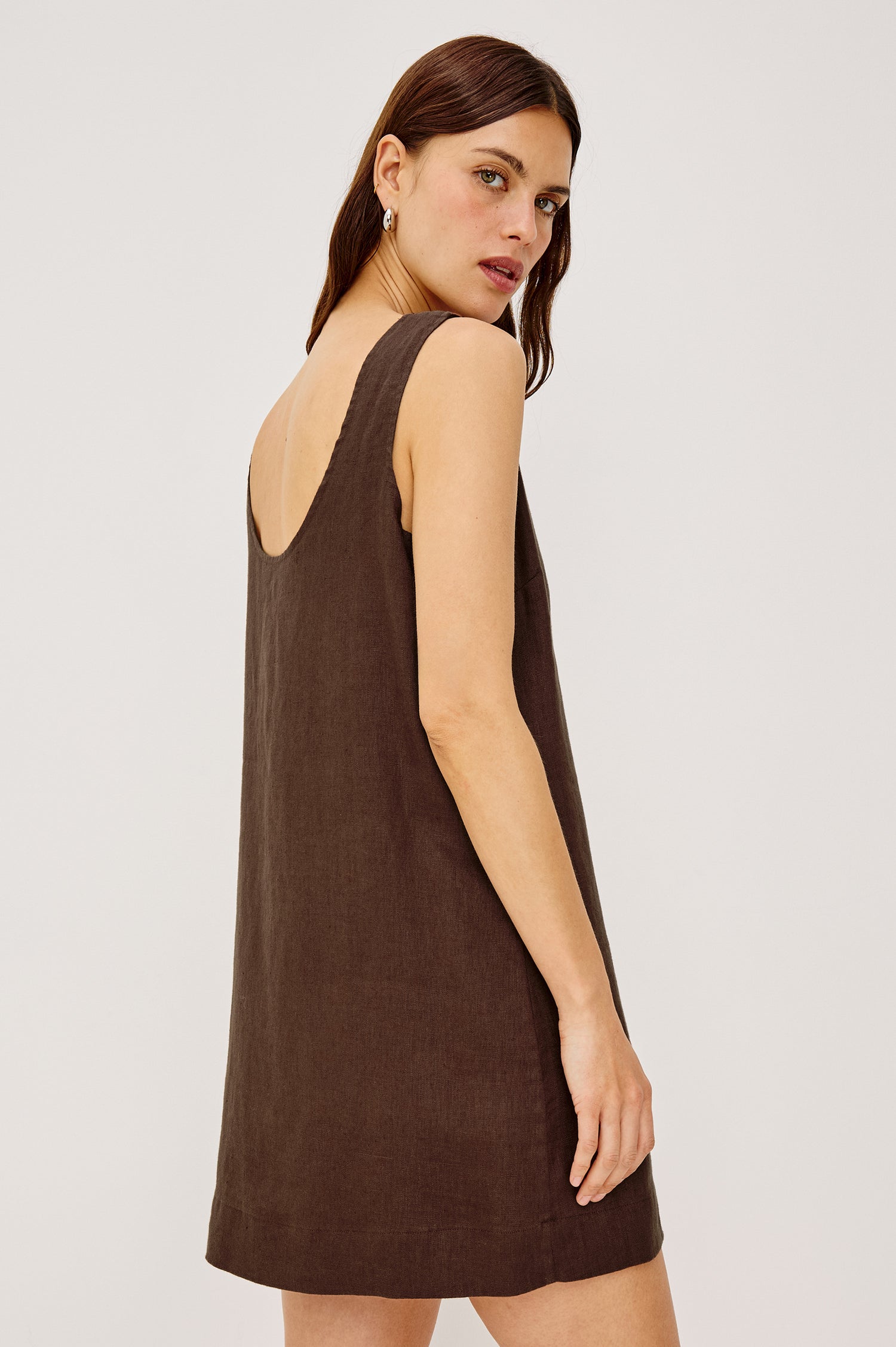 Lindsey Mini Dress in Linen With High Neck, Scoop Back, Relaxed Fit, and is Fully Lined in Espresso Colorway - Upper Body Back View Featured on Model