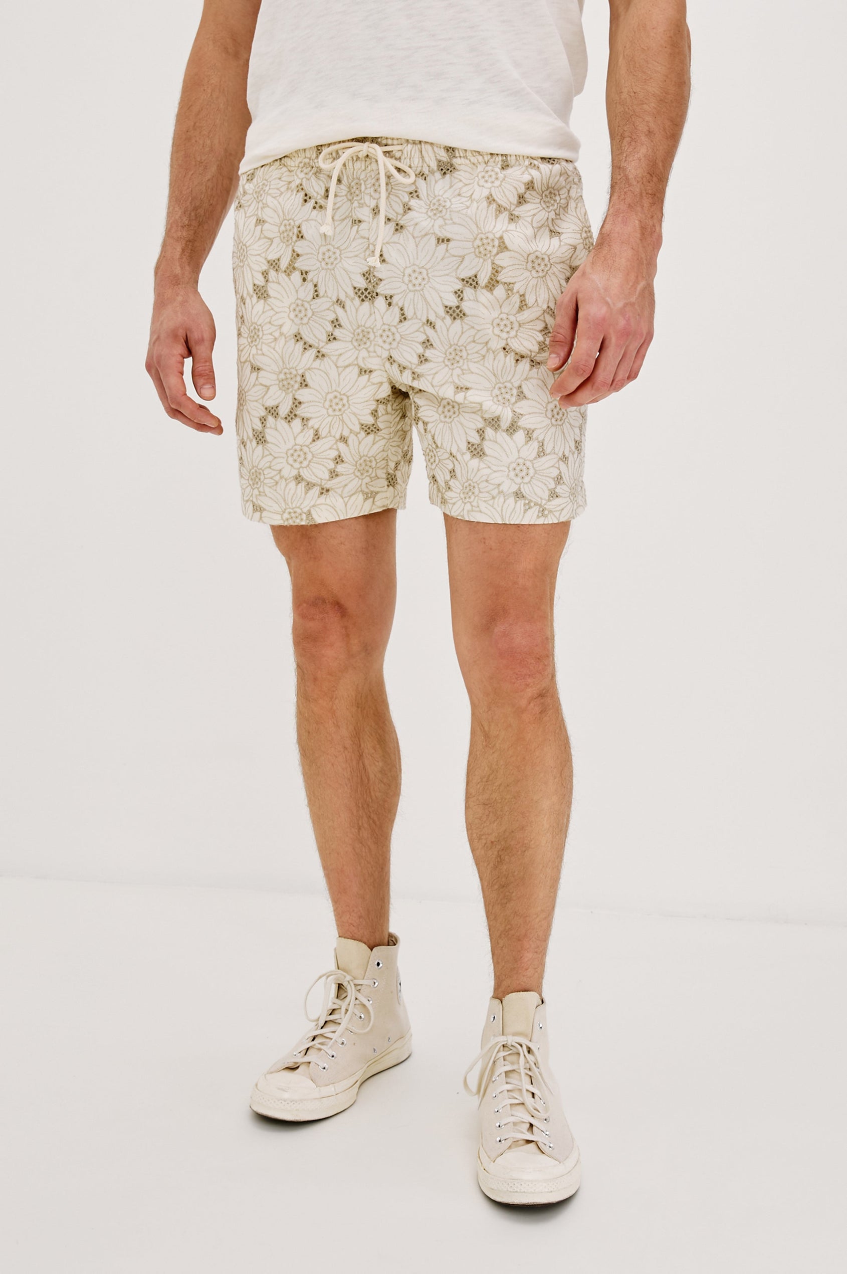 Logan Swim Short with a Drawstring Waistband and Side Pockets in Multi Blue Sunflower Colorway. Front View Shown on Model.