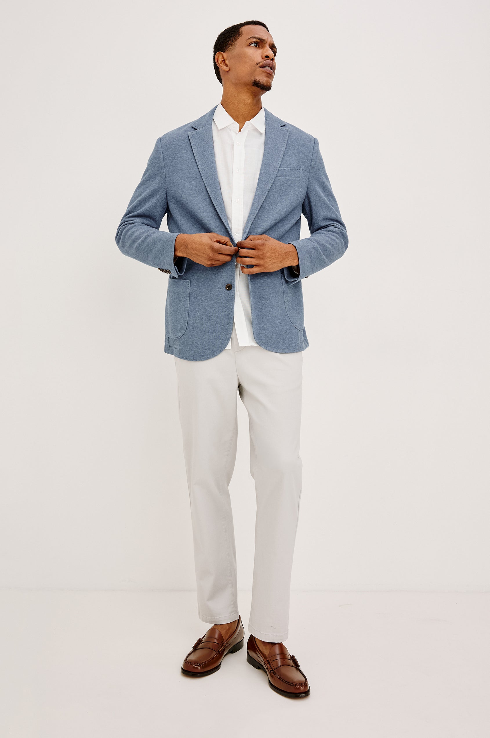Lorenz Blazer in Nylon With Single Breasted Front Buttons, Single Chest Patch Pocket, Side Patch Pockets, and Long Sleeves in Heather Blue Colorway - Full Body Front View Featured on Model