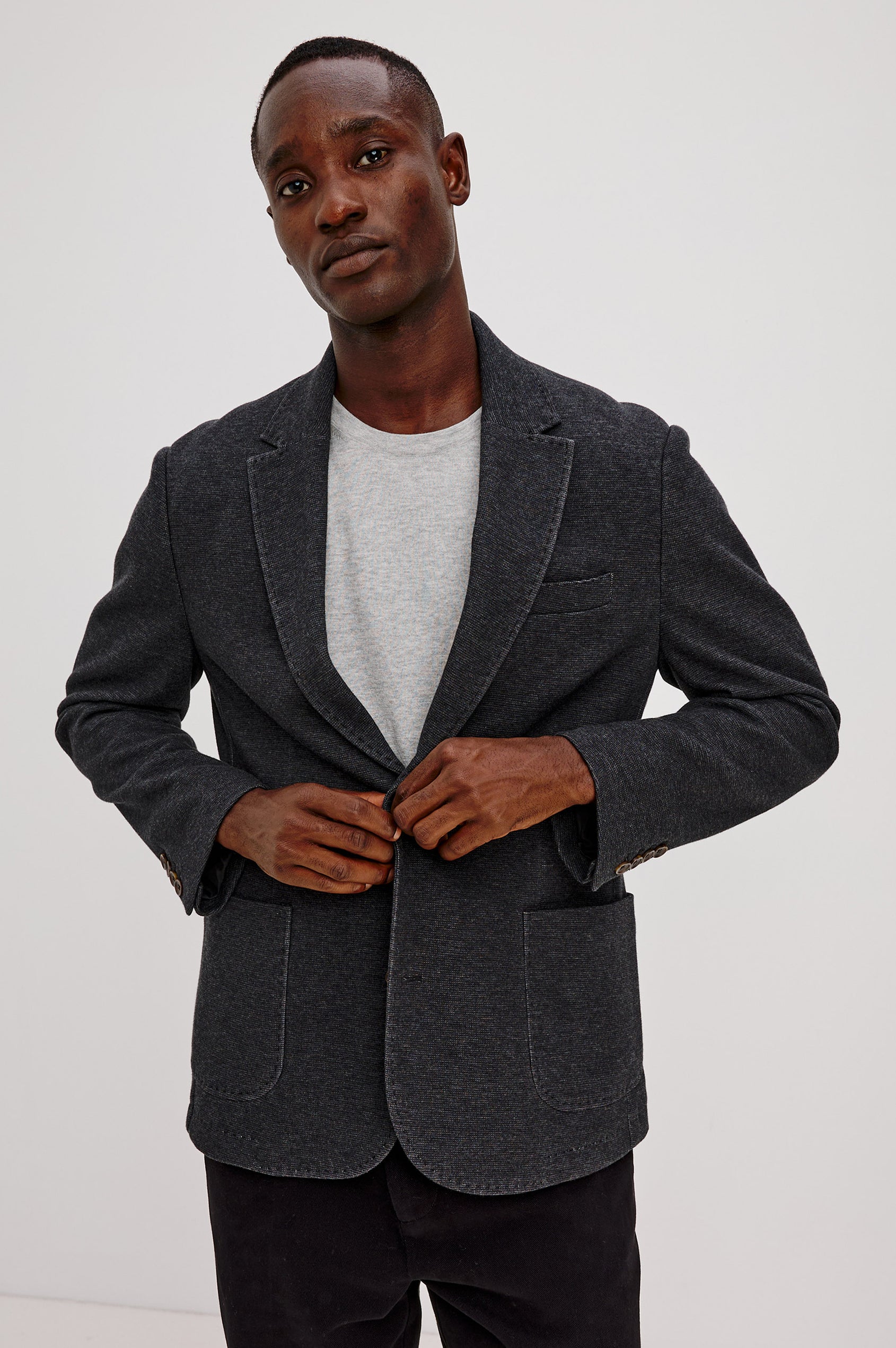 Lorenz Blazer in Ponte Jersey With Single-Breasted Design, Relaxed Fit, Jersey Lining, Notched Lapels, Chest Welt Pocket, Side Patch Pockets, Button-Cuff Long Sleeves, and Double Back Vents in Night Heather Colorway - Upper Body Front View Featured on Model