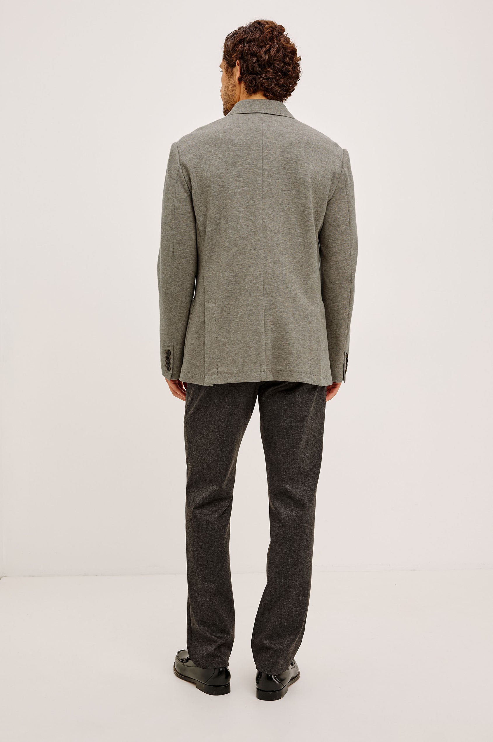 Lorenz Blazer in Ponte Jersey With Single-Breasted Design, Relaxed Fit, Jersey Lining, Notched Lapels, Chest Welt Pocket, Side Patch Pockets, Button-Cuff Long Sleeves, and Double Back Vents in Walnut Heather Colorway - Full Body Back View Featured on Model