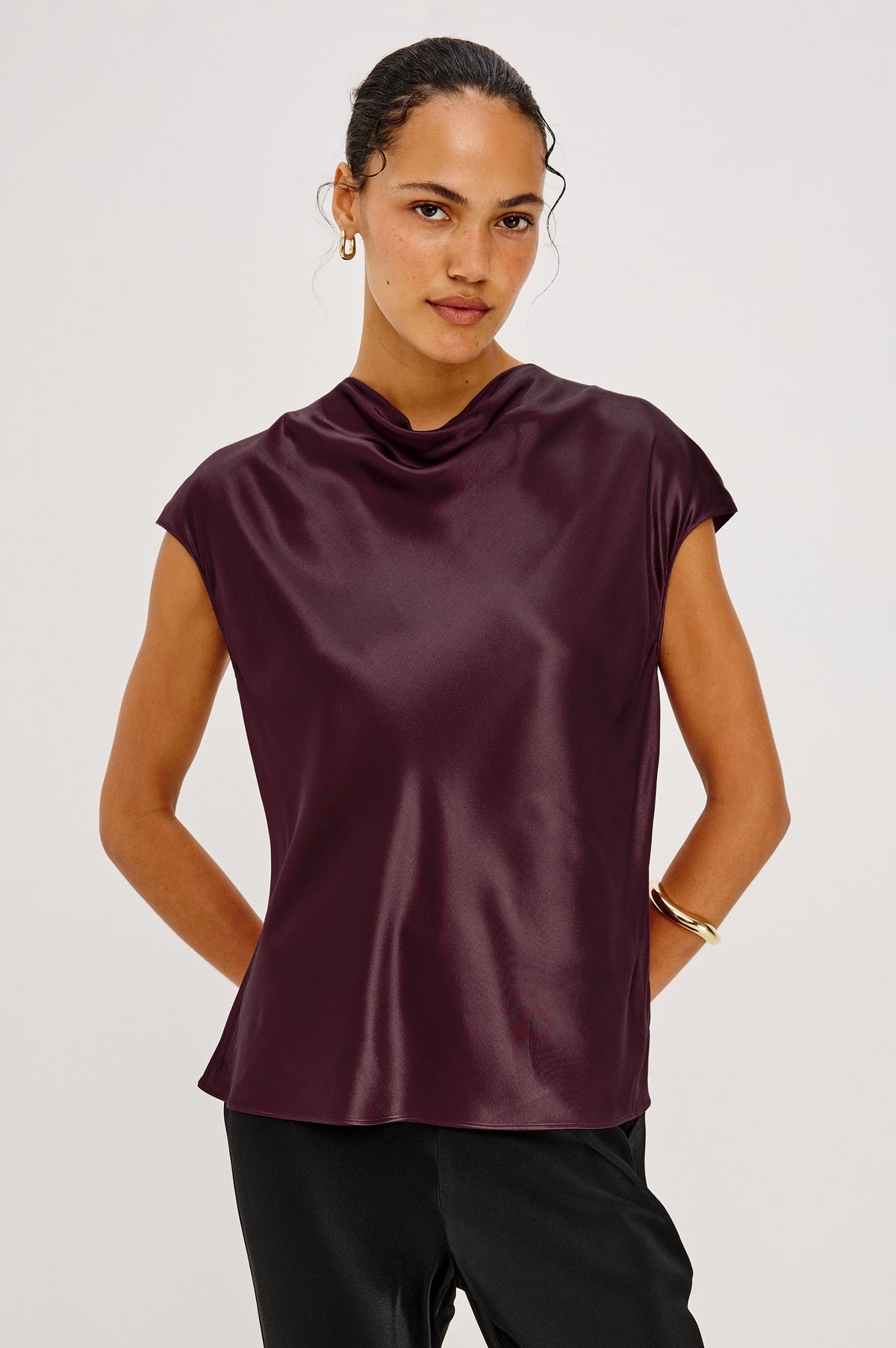 Loretta Top in Satin-Back Crepe With Cap Sleeve, Mock Neckline, Straight Hem, Keyhole Back, and Button-and-Loop Closure in Wine Colorway - Front Crop View Featured on Model.