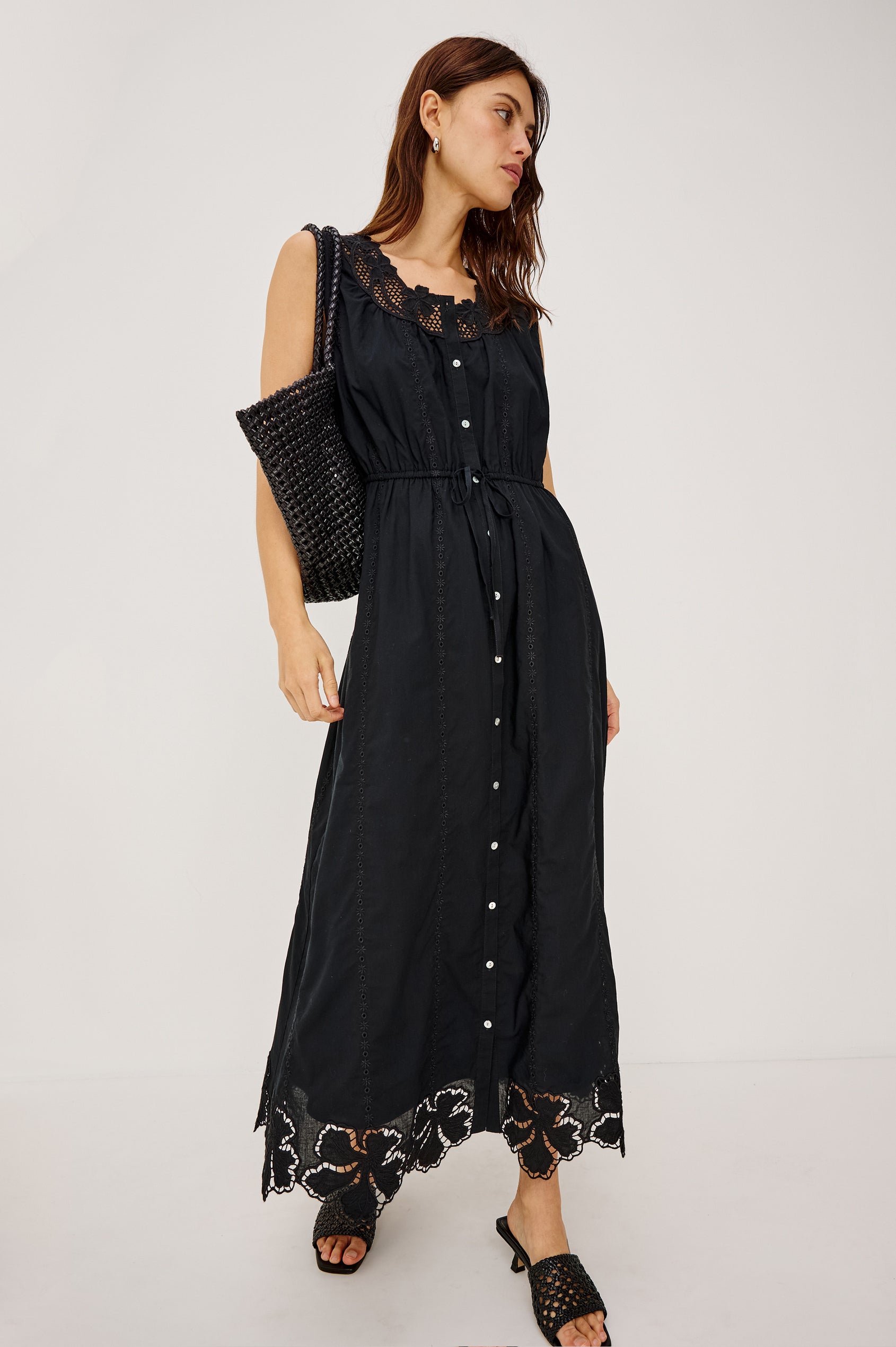 Lorina Midi Dress in Cotton Voile With Lattice and Floral Embroidery, Sleeveless Cut, and Adjustable Waist Ties in Black Colorway - Full Body Front View Featured on Model