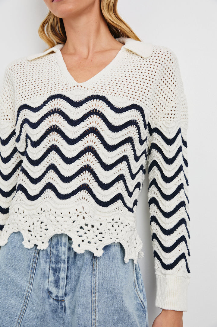 Louise Long-Sleeve, V-Neck Sweater with Collar, Floral Scalloped Hem, Open-Knit Crochet with a Solid Band at the Center in Wave Stripe Colorway, Navy waves on white - Front View on Model