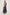 Loulou V-Neck Midi Dress with Smocked Elastic Waistband and a Multi Tiered Skirt in navy blue Magalia Stripe Colorway. Full Body Side View Shown on Model.