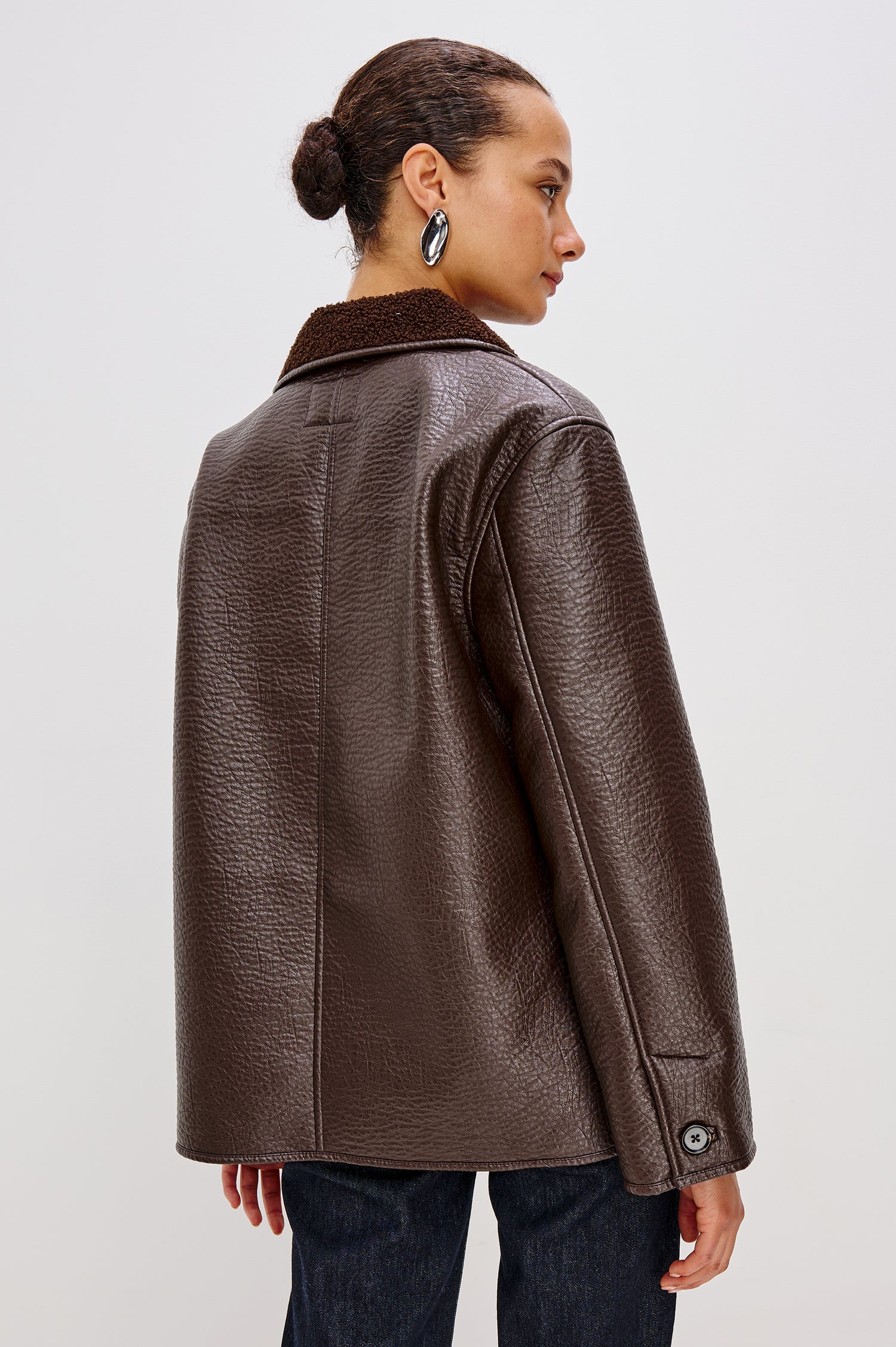 Leah Jacket in Vegan Pebbled Leather With Plush Faux Shearling Collar and Lining, Front Buttons, Zippered Side Pockets With O-Ring Pulls in Walnut Colorway - Upper Body Back View Featured on Model