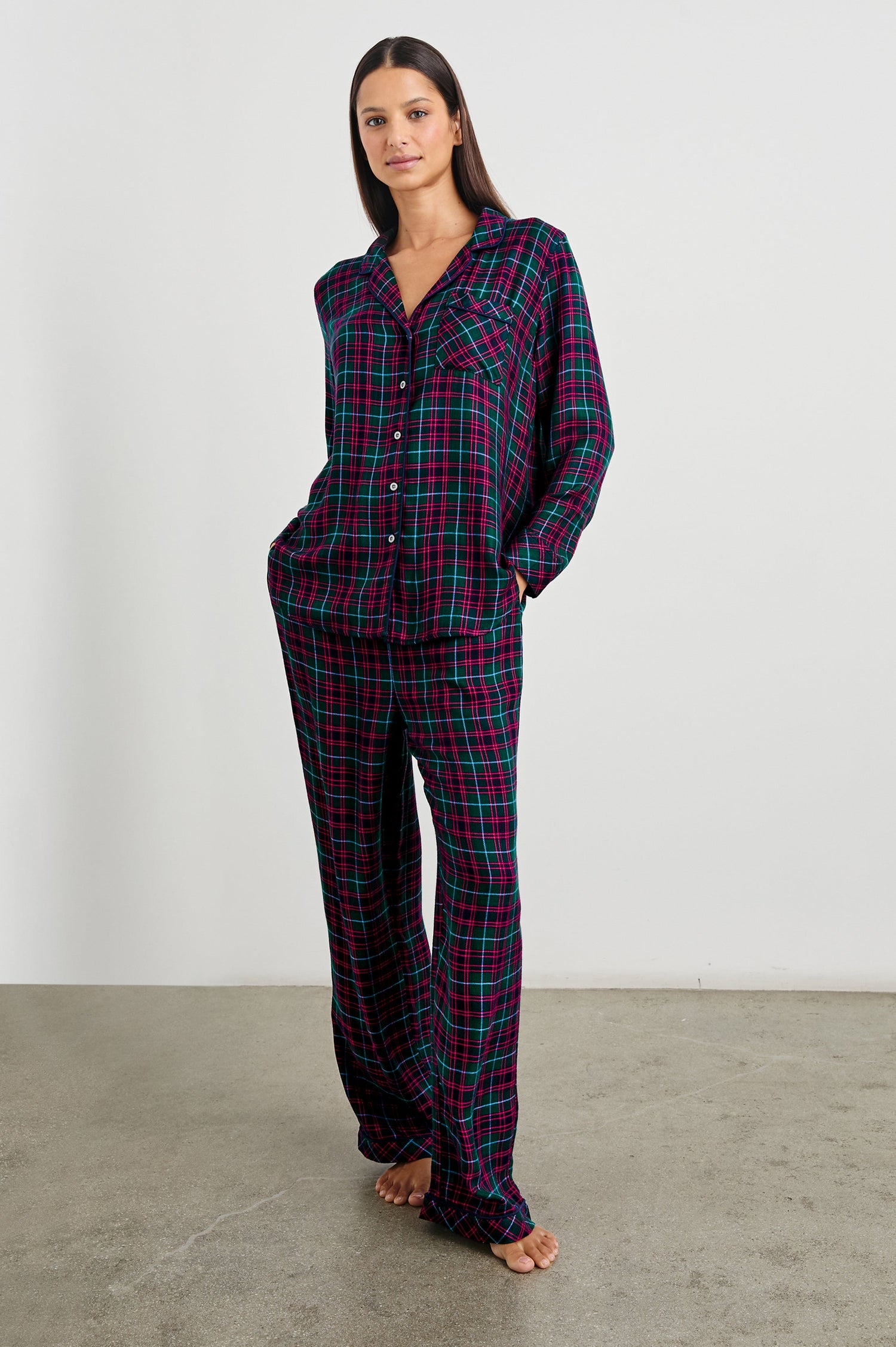 Luna Pajama Set with a Long Sleeve, Button Up, V Neck Top with a Chest Patch Pocket and Pants with Two Front Pockets in Evergreen Fuchsia Ice Colorway, a plaid - Front Full Body View Featured on Model  