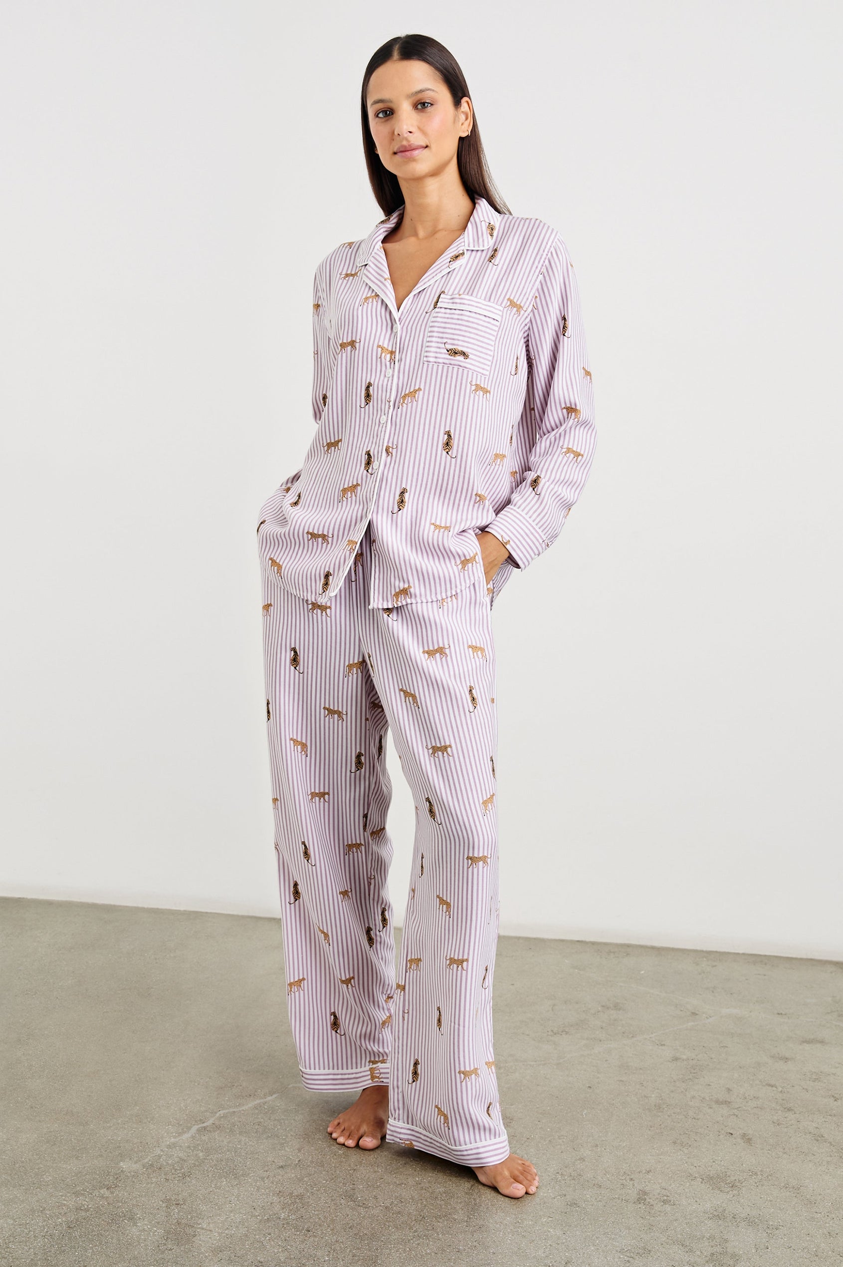 Luna Pajama Set with a Long Sleeve, Button Up, V Neck Top with a Chest Patch Pocket and Pants with Two Front Pockets in Rose Stripe Cats Colorway, Gold Wildcats on Rose and White Vertical Stripes - Front Full Body View Featured on Model  