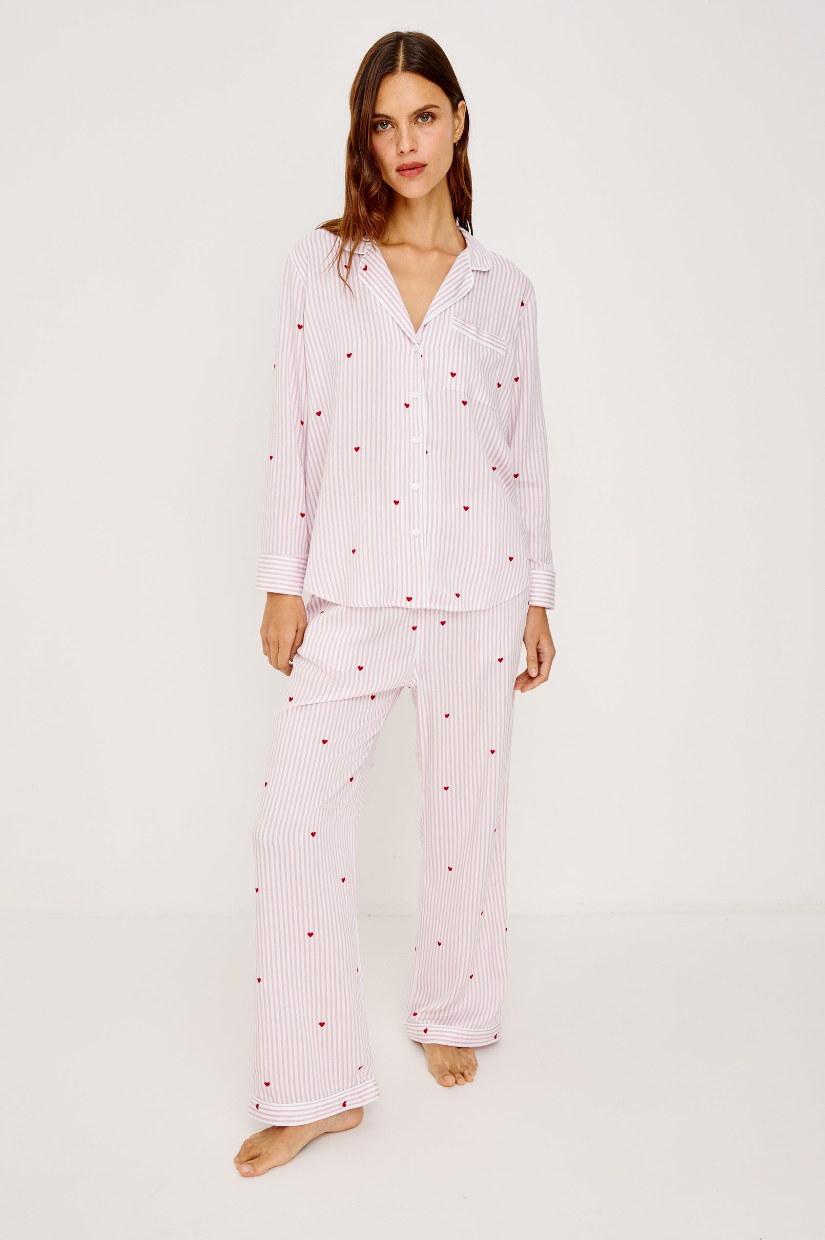 Luna Pajama Set in Signature Rayon With Button-Up Collared Shirt With Front Buttons, Long Sleeves, Chest Patch Pocket and Matching Pant With Side Pockets and Drawstring Waist Ties in Rose Stripe Hearts Colorway - Full Body Front View Featured on Model