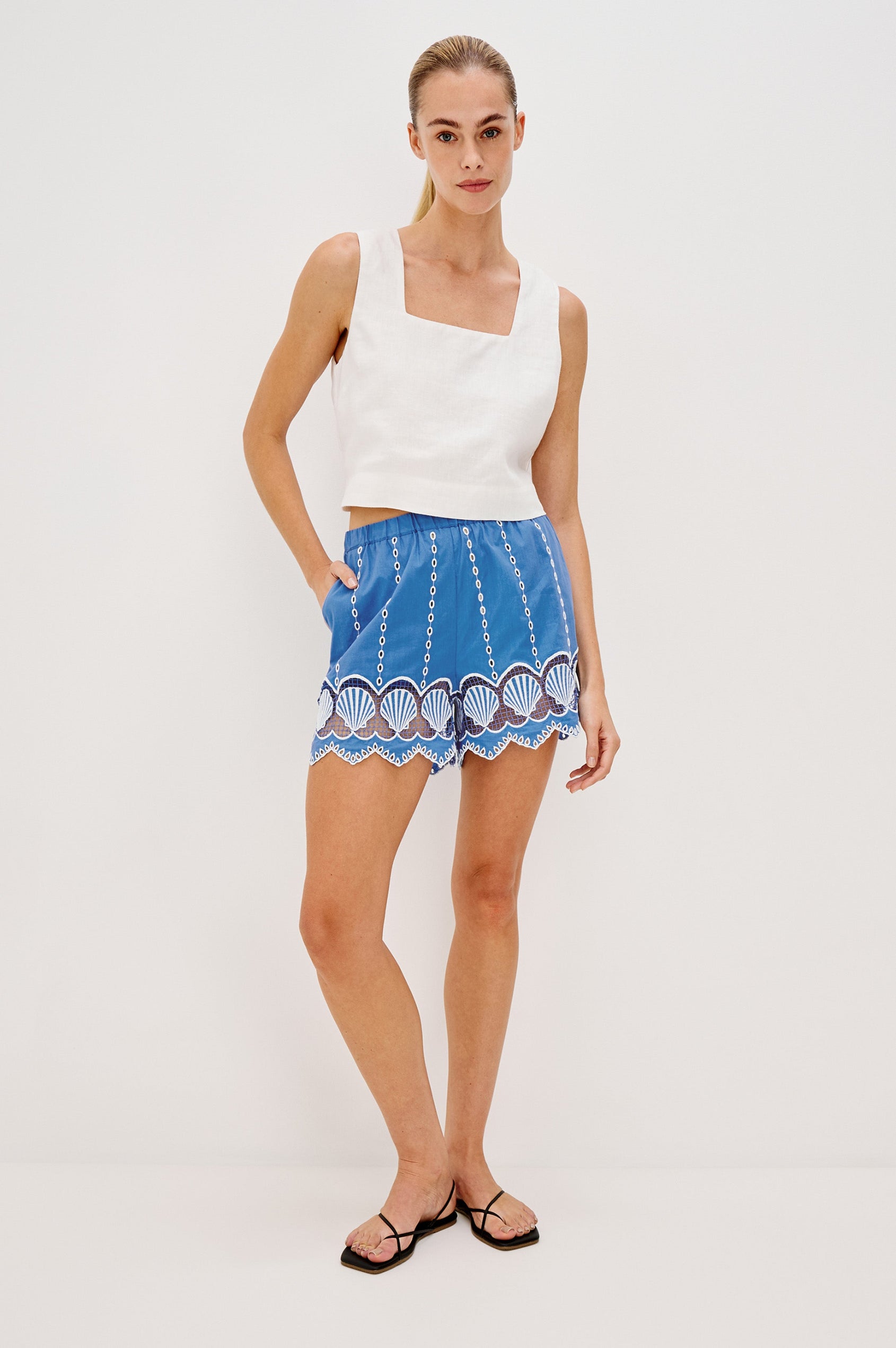 Mai Pull On Short with Elastic Waist, Embroidery and Scalloped Hem in French Blue Colorway. Front Full Body View Shown on Model.