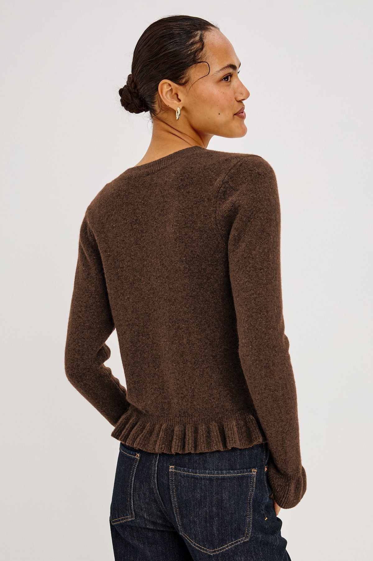 Mandy Sweater in Cashmere-Cotton-Wool Blend Knit Front Buttons, Long Sleeves, Classic Slightly Cropped Fit, and Ribbed Ruffle Trim in Heather Latte Colorway - Back Crop View Featured on Model.