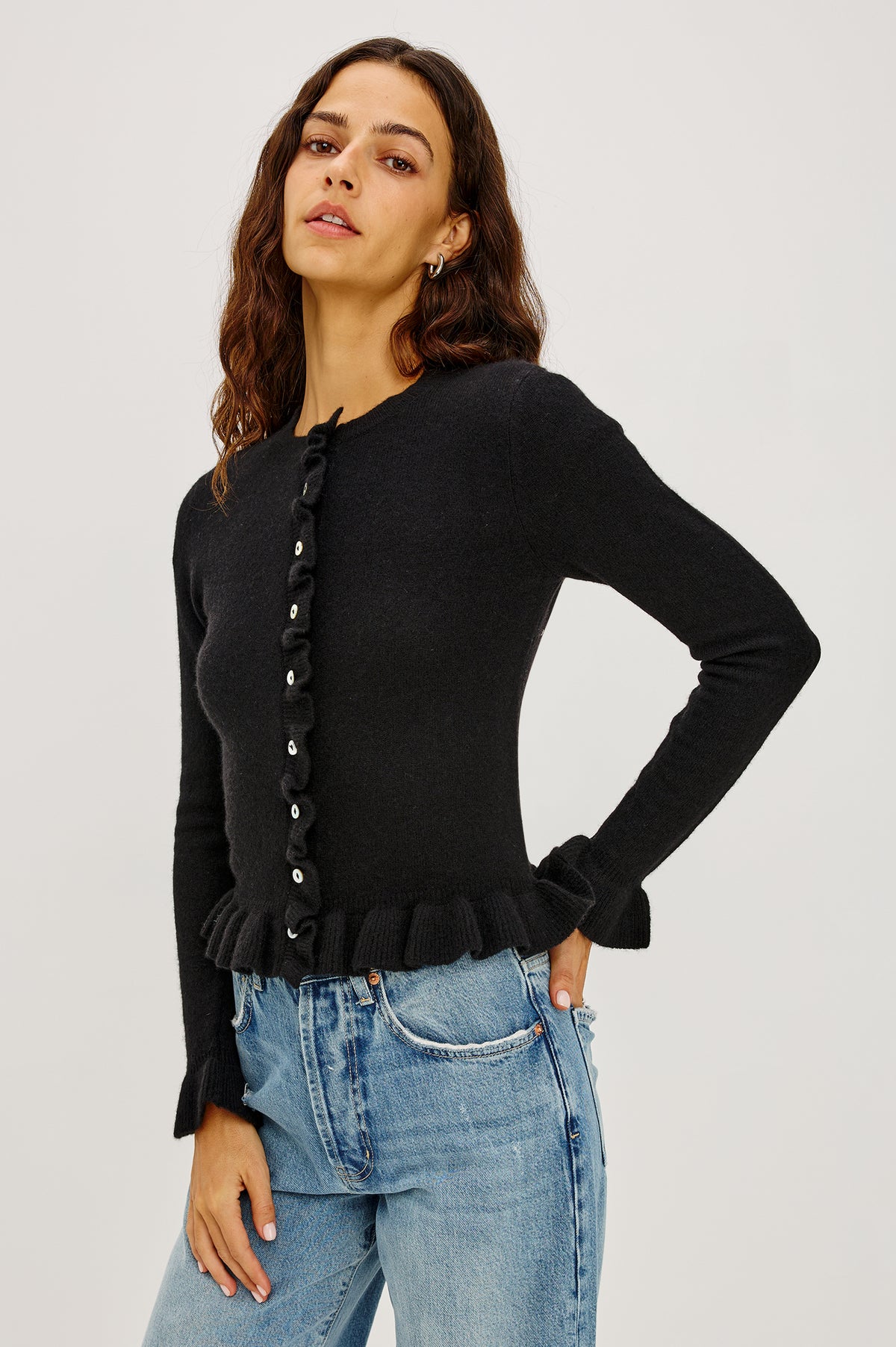 Mandy Sweater in Cashmere-Cotton-Wool Blend Knit Front Buttons, Long Sleeves, Classic Slightly Cropped Fit, and Ribbed Ruffle Trim in Black Colorway - Front Crop View Featured on Model.