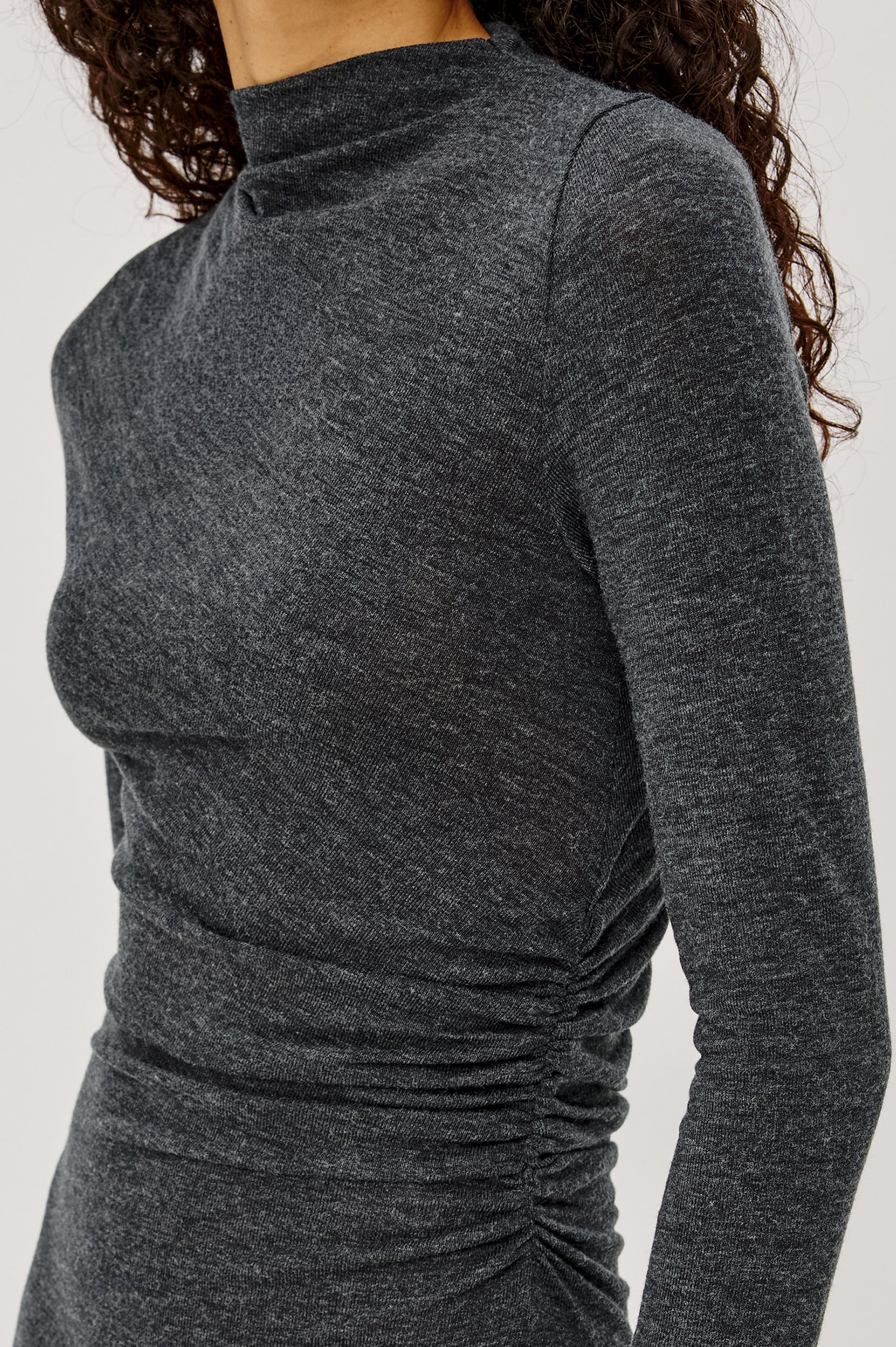 Margaret Midi Dress in Brushed Tissue Jersey With Mock Neck, Long Sleeves, Ruched Sides, and Fitted Silhouette in Charcoal Colorway - Upper Body Close Up View Featured on Model