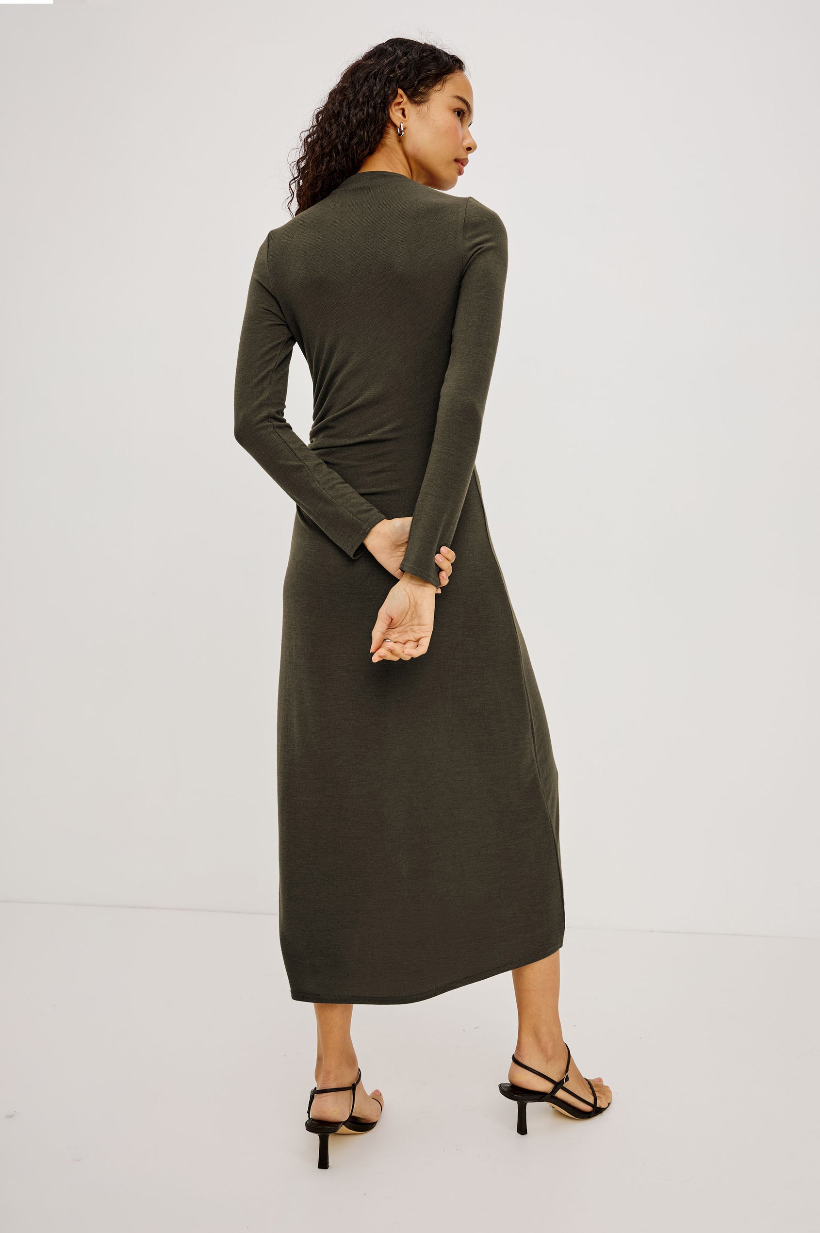 Margaret Midi Dress in Brushed Tissue Jersey With Mock Neck, Long Sleeves, Ruched Sides, and Fitted Silhouette in Heather Olive Colorway - Full Body Back View Featured on Model