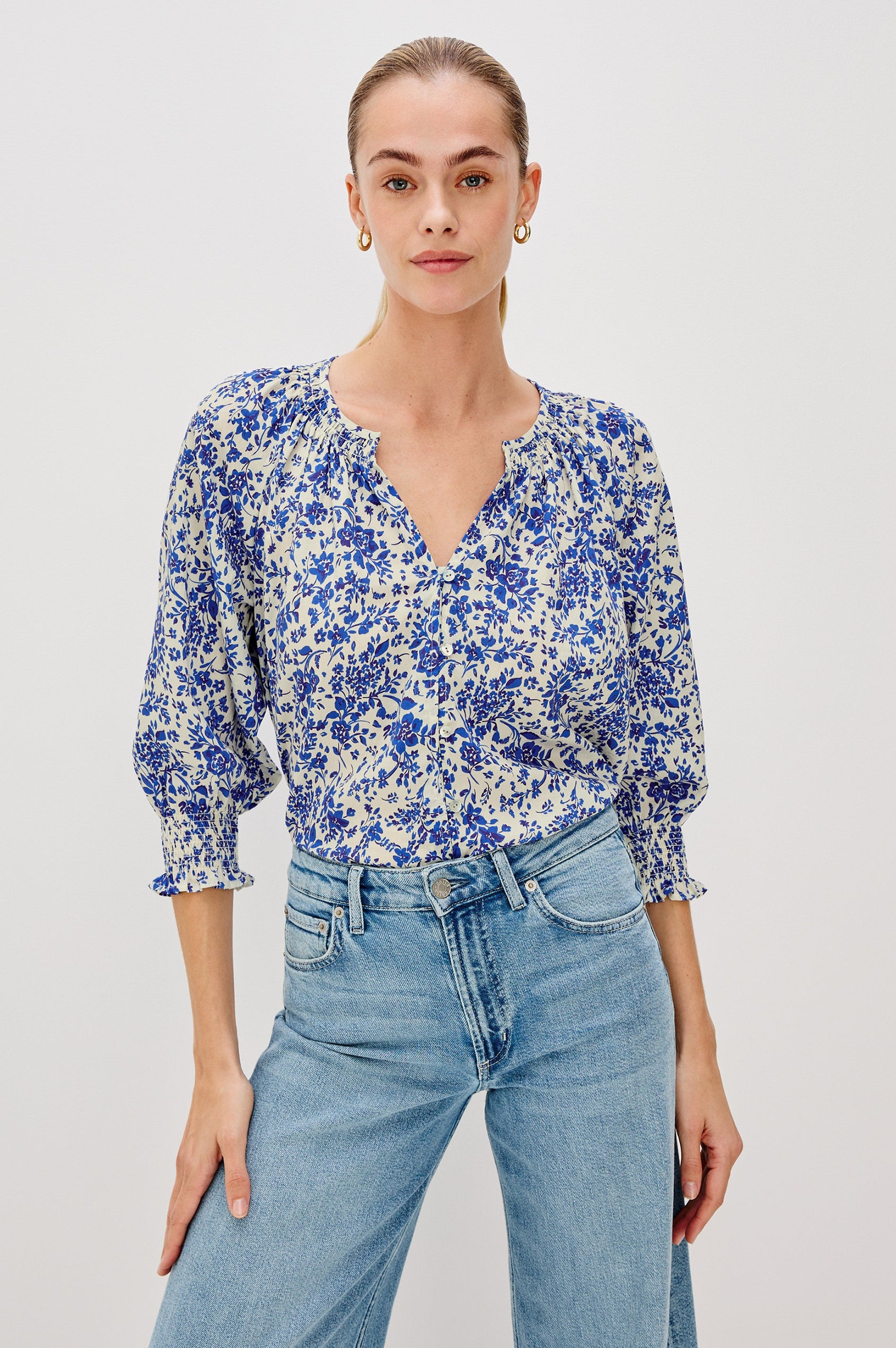 Mariah Button Down Shirt With 3/4" Length Sleeves with Elastic Smoking at Sleeve Hem, V-Neck and Half Button Front in Blue Marguerite Colorway - Front View Featured on Model.
