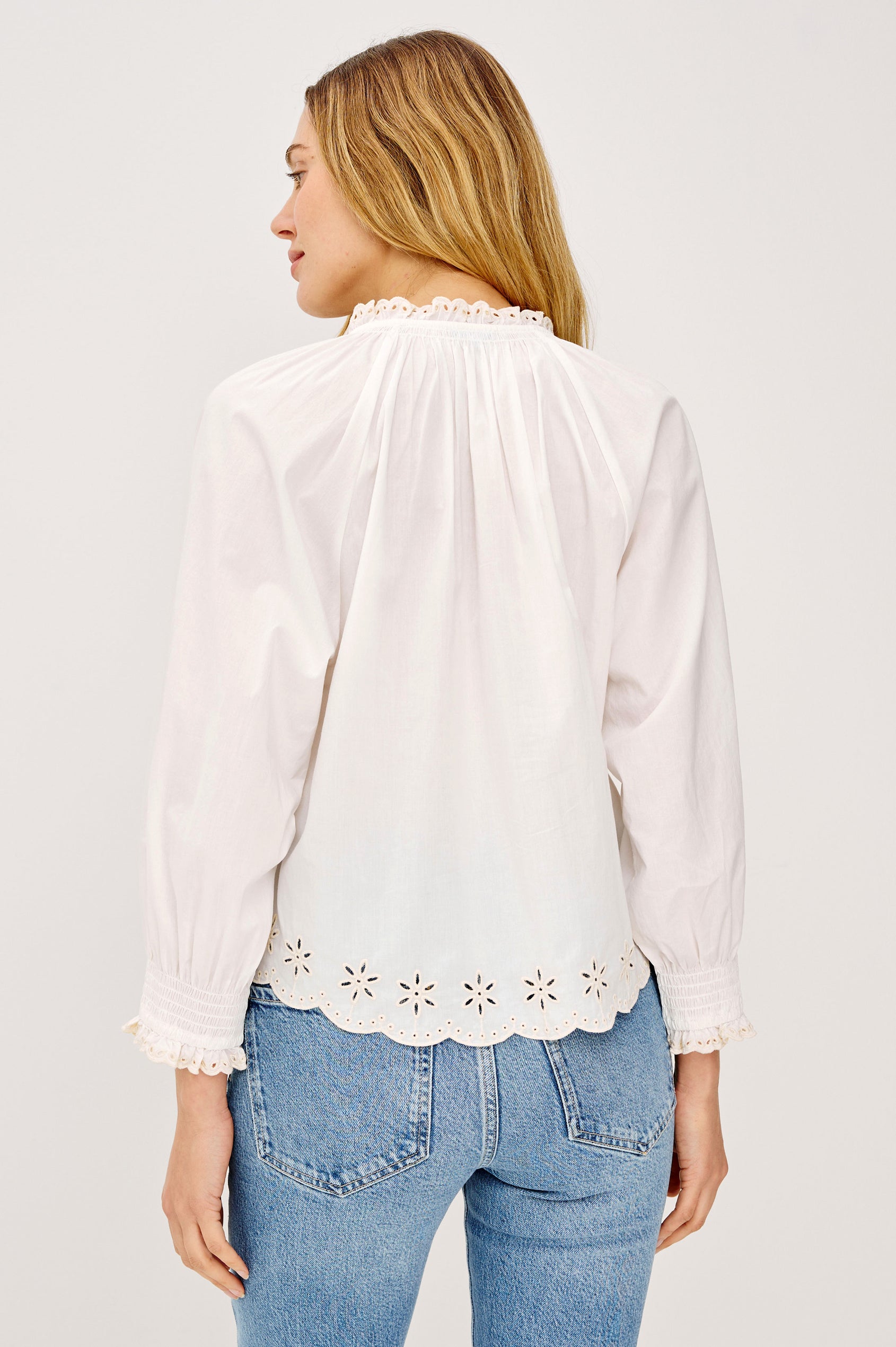 Mariah Peasant Style Bouse Top in Beach Cotton With Split V-Neck Collar, Front Buttons, Smocked Cuffs, and Loose Fit in Oat Embroidery - Upper Body Back View Featured on Model