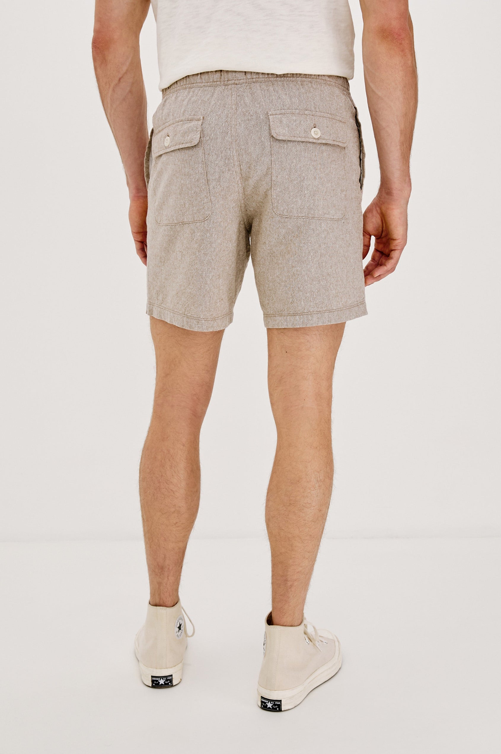 Martin Pull on Short with a an Elastic and Drawstring Waist and Side Pockets in Bulgur Oat Colorway. Back View Shown on Model.