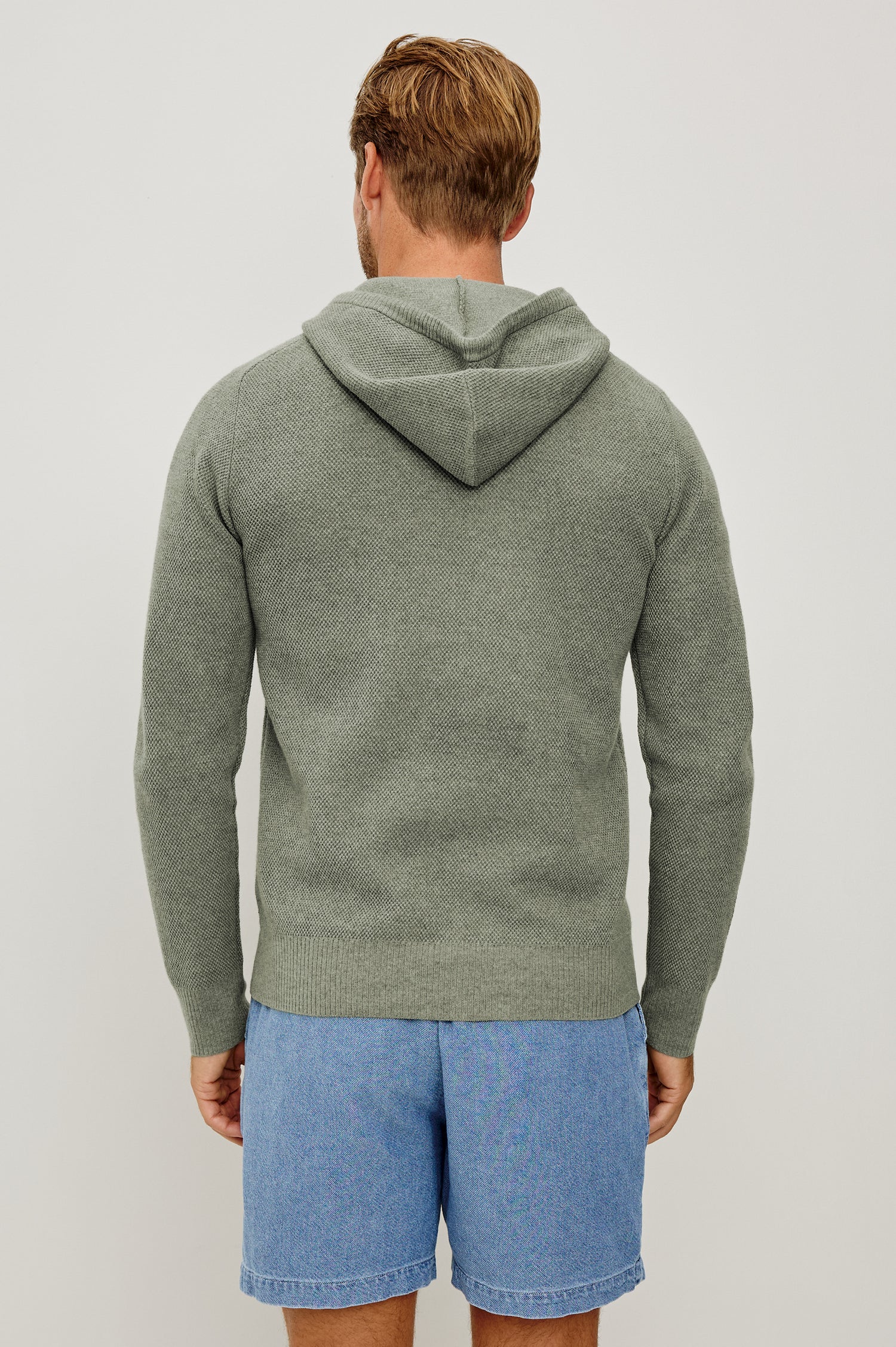 Matador Hoodie Sweatshirt in Cotton Blend With Drawstring TIes, Front Kangaroo Pockets, and Long Sleeves in Sage Heather - Upper Body Back View Featured on Model