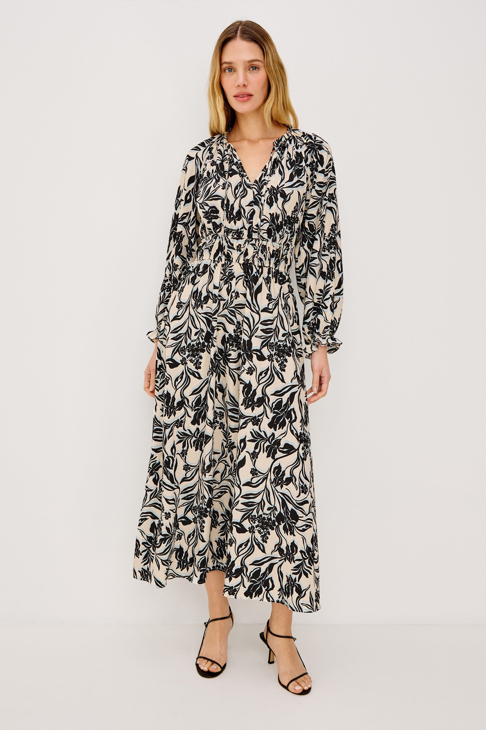 Matia Maxi Dress in Cotton With Banded Ruffle V-Neckline With Self-Ties, Elastic Waist, and Long Raglan Puff Sleeves in Zinya Colorway - Full Body Front View Featured on Model