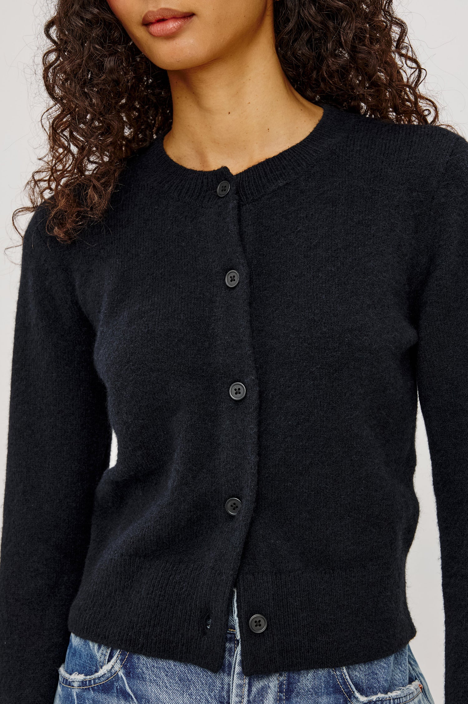 Matilda Cardigan in Wool-Blend Knit WIth Relaxed Slightly Cropped Fit, Crew Neck, Front Buttons, and Ribbed Trim in Black Colorway - Upper Body Front View Featured on Model