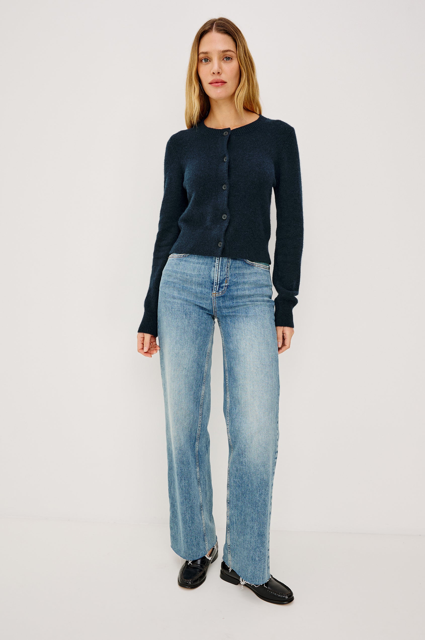 Matilda Cropped Long-Sleeve Sweater with Button Closure Crew Neck and Ribbed Trim in Navy Colorway - Front View Featured on Model