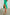 Maya Midi Skirt with Mid-Thigh Side Slit in Jade Colorway - Side View Featured on Model