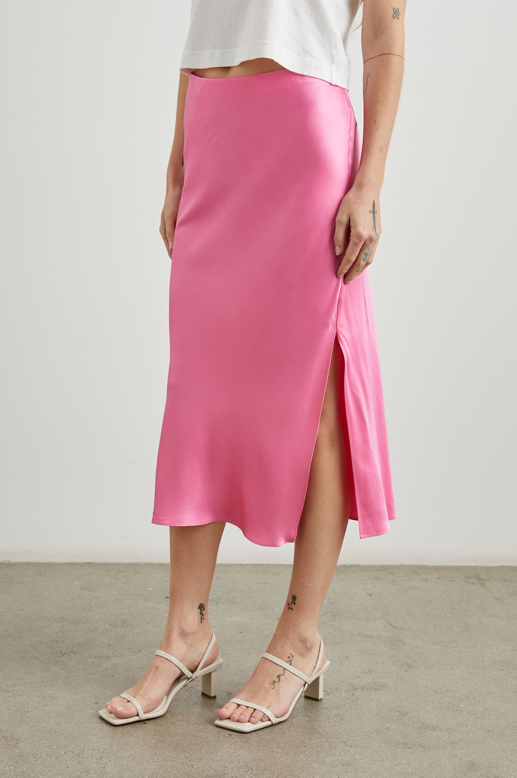 Maya Midi Skirt with Mid-Thigh Side Slit in Malibu Pink Colorway - Front View Featured on Model