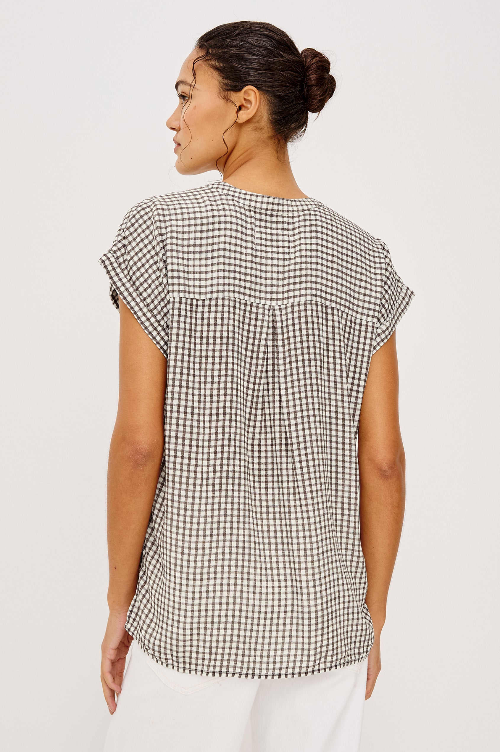 Mel Boxy Button-Up Shirt With Ruffled Cap Sleeves Banded V-Neckline Front Buttons Chest Patch Pockets and Curved High Neckline in Espresso Gingham - Upper Body Back View Featured on Model