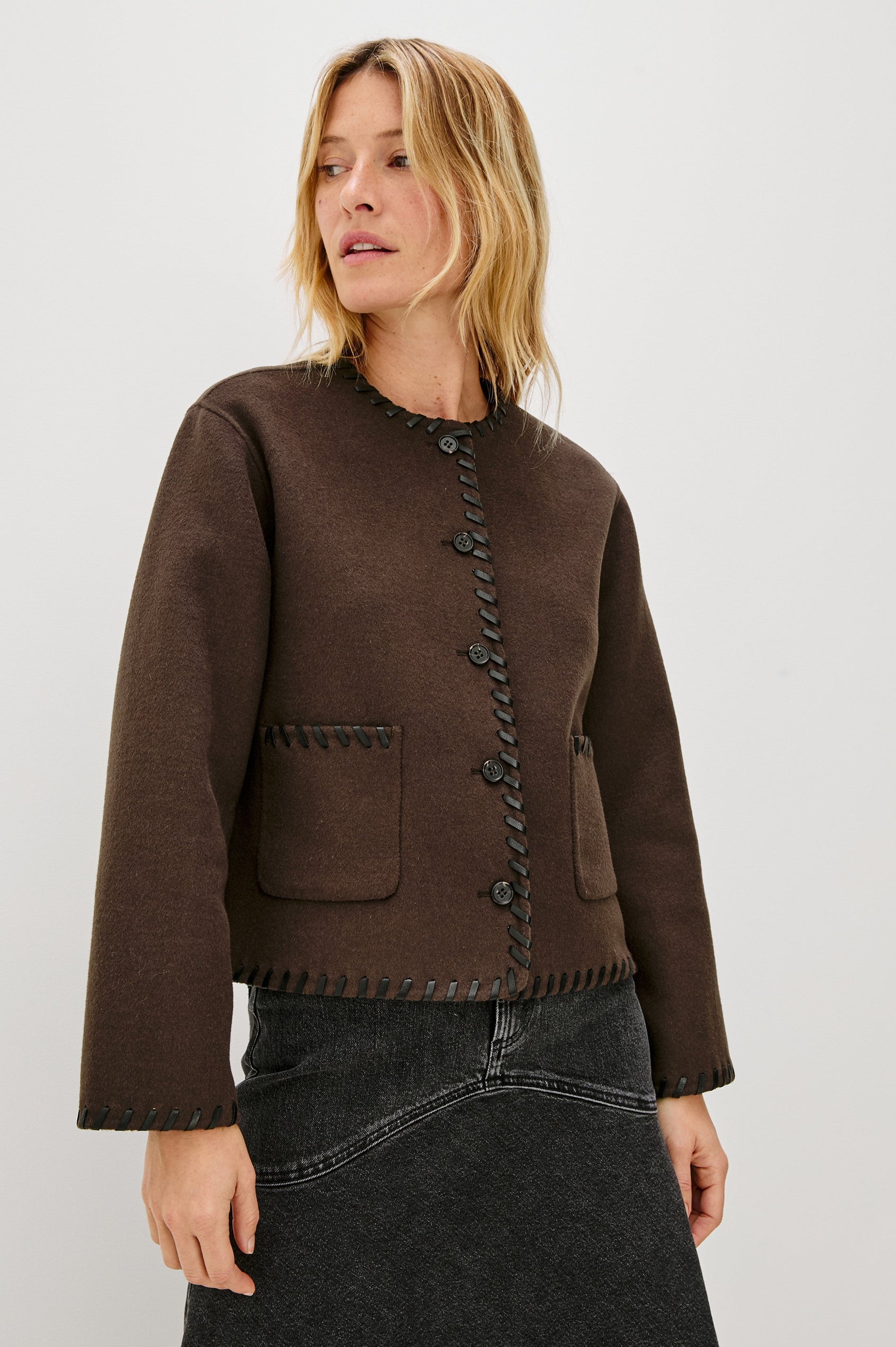 Melanie Jacket with Button Closure and Two Front Patch Pockets in Dark Brown Colorway, with Leather Whipstitching along the Trim and Pockets - Front View Featured on Model