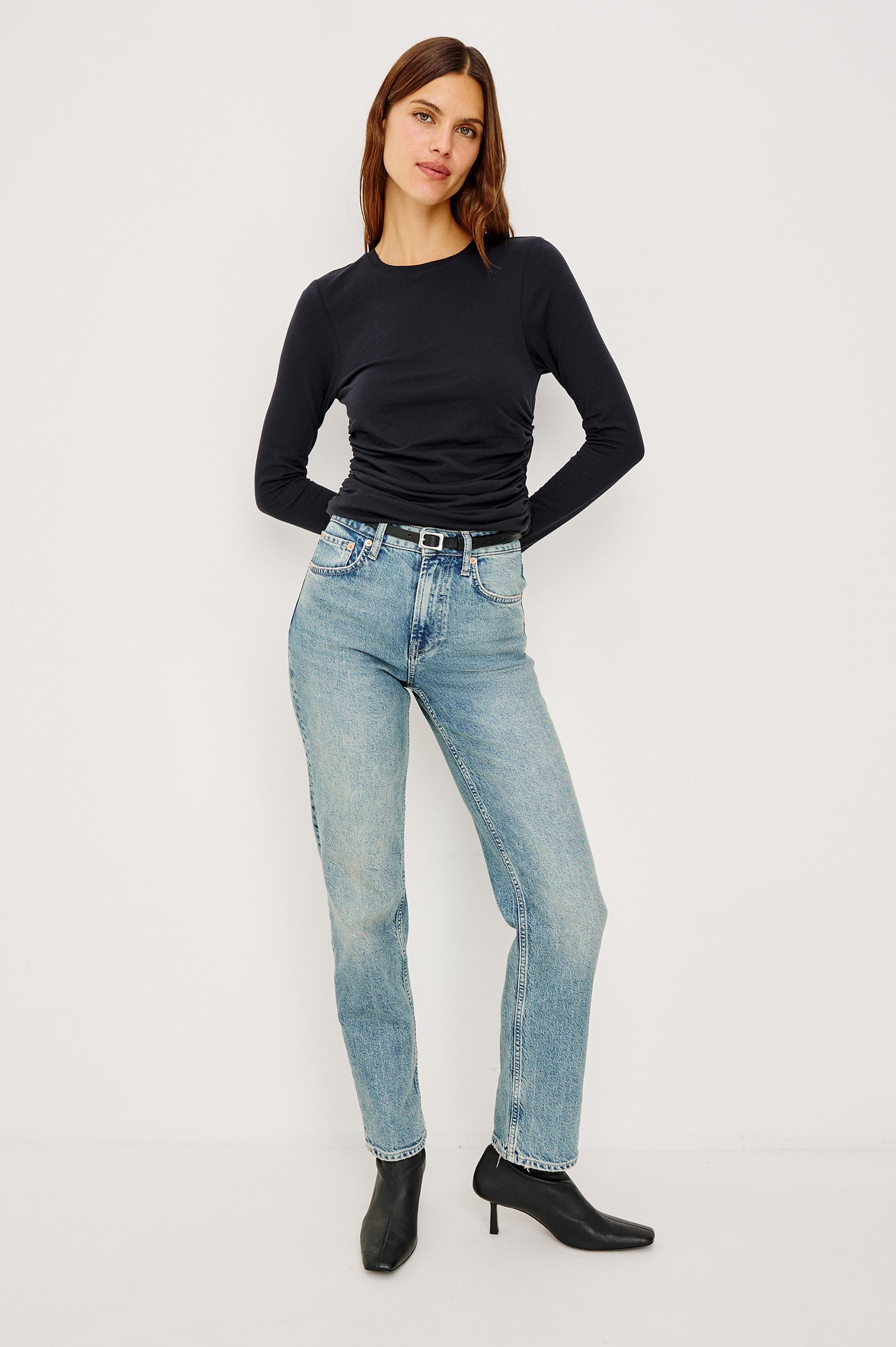 Melle Fitted Top in Organic Cotton With Crew Neckline, Side Shirring, and Long Sleeves in Black Colorway - Full Body Front View Featured on Model