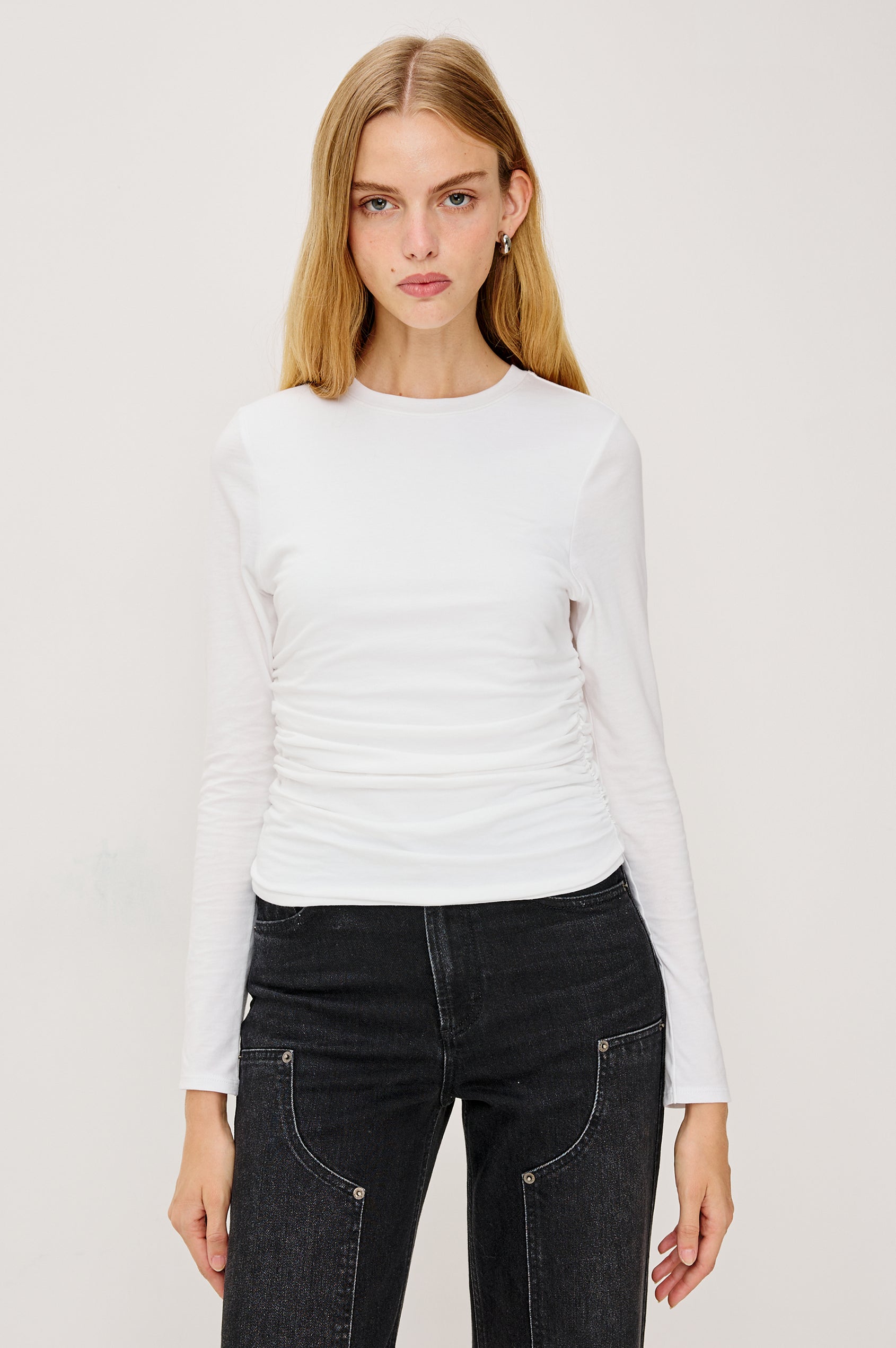 Melle Fitted Top in Organic Cotton With Crew Neckline, Side Shirring, and Long Sleeves in White Colorway - Upper Body Front View Featured on Model