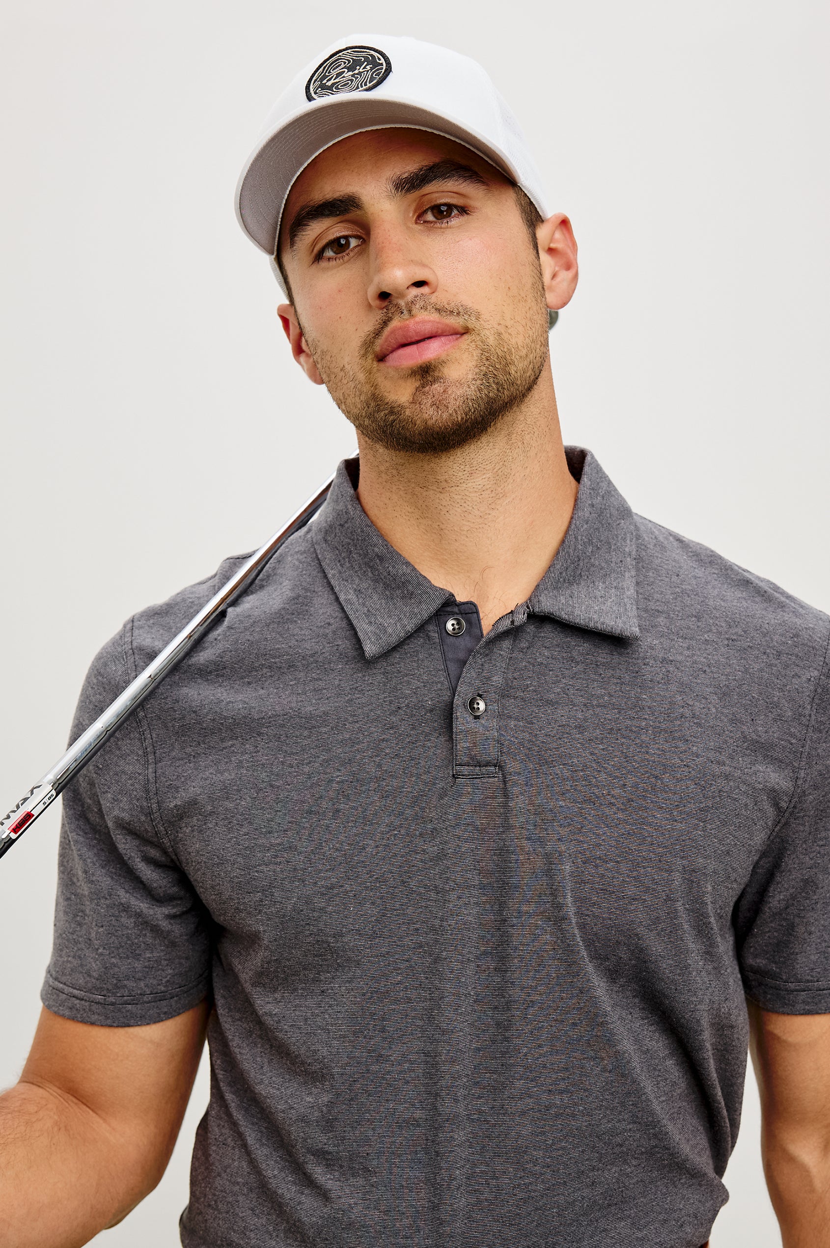 Merced Golf Polo in TENCEL™ Poly Blend With Collar, Quarter Placket, Short Sleeves, and Classic Fit in Charcoal Heather Stripe Colorway - Upper Body Front View Featured on Model