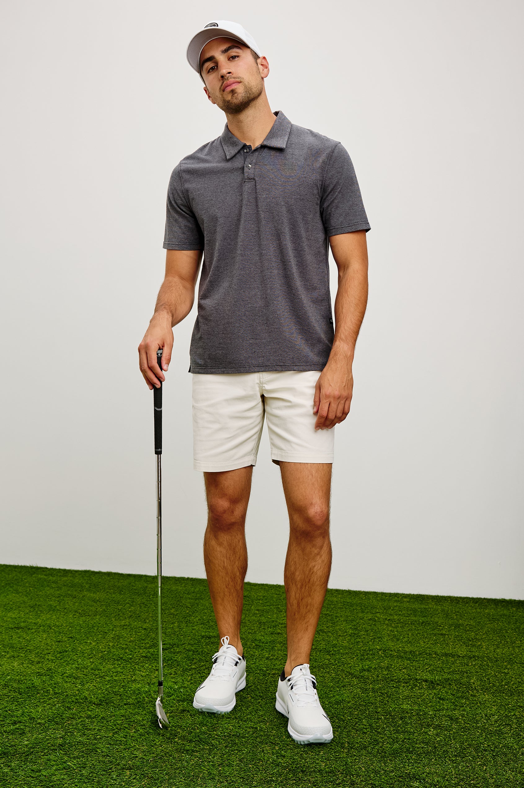 Merced Golf Polo in TENCEL™ Poly Blend With Collar, Quarter Placket, Short Sleeves, and Classic Fit in Charcoal Heather Stripe Colorway - Full Body Front View Featured on Model