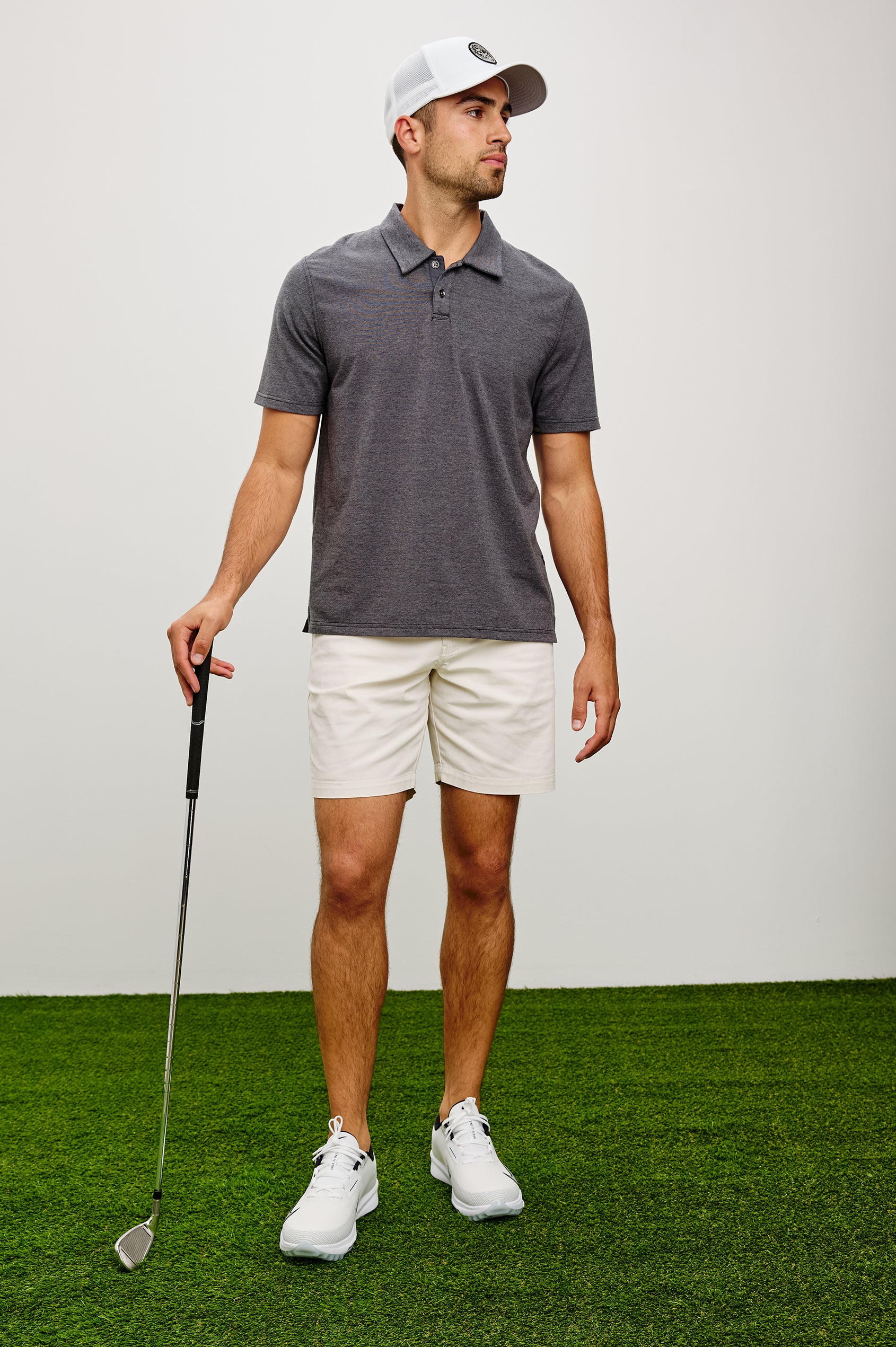 Merced Golf Polo in TENCEL™ Poly Blend With Collar, Quarter Placket, Short Sleeves, and Classic Fit in Charcoal Heather Stripe Colorway - Full Body Front View Featured on Model