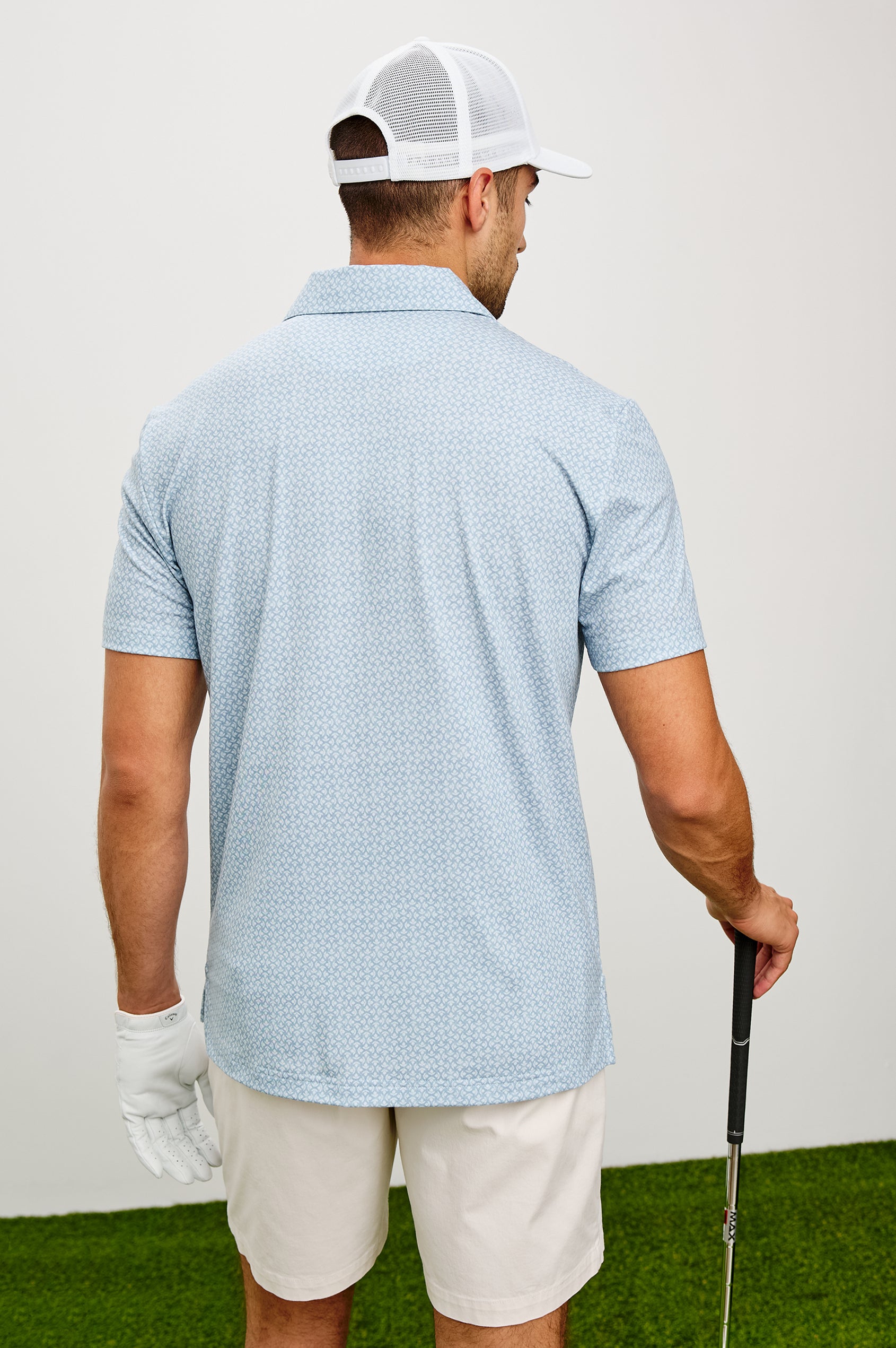 Merced Golf Polo in TENCEL™ Poly Blend With Collar, Quarter Placket, Short Sleeves, and Classic Fit in Cuyama Batik Glass Colorway - Upper Body Back View Featured on Model