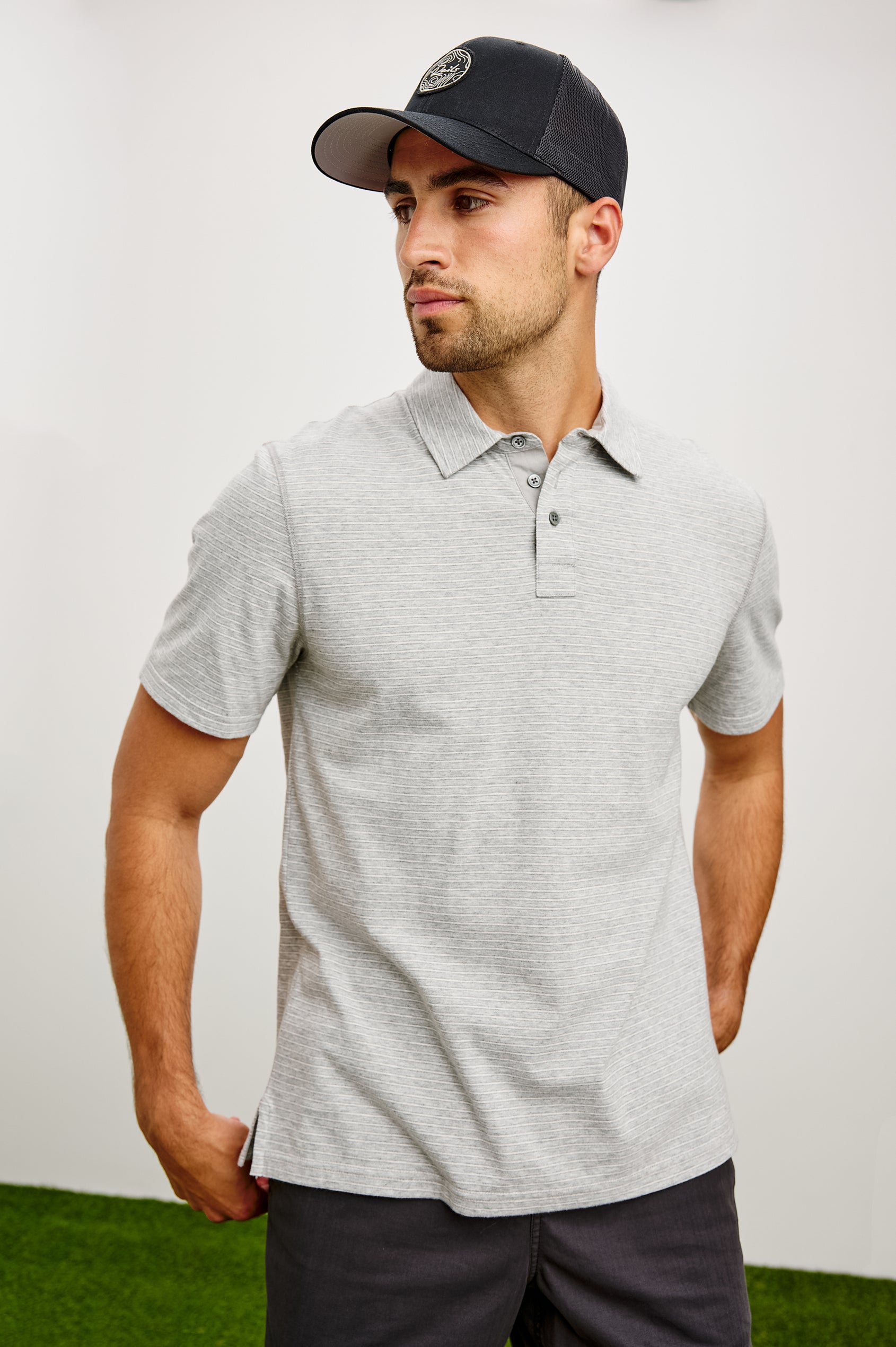 Merced Golf Polo in TENCEL™ Poly Blend With Collar, Quarter Placket, Short Sleeves, and Classic Fit in Heather Grey Stripe Colorway - Upper Body Front View Featured on Model