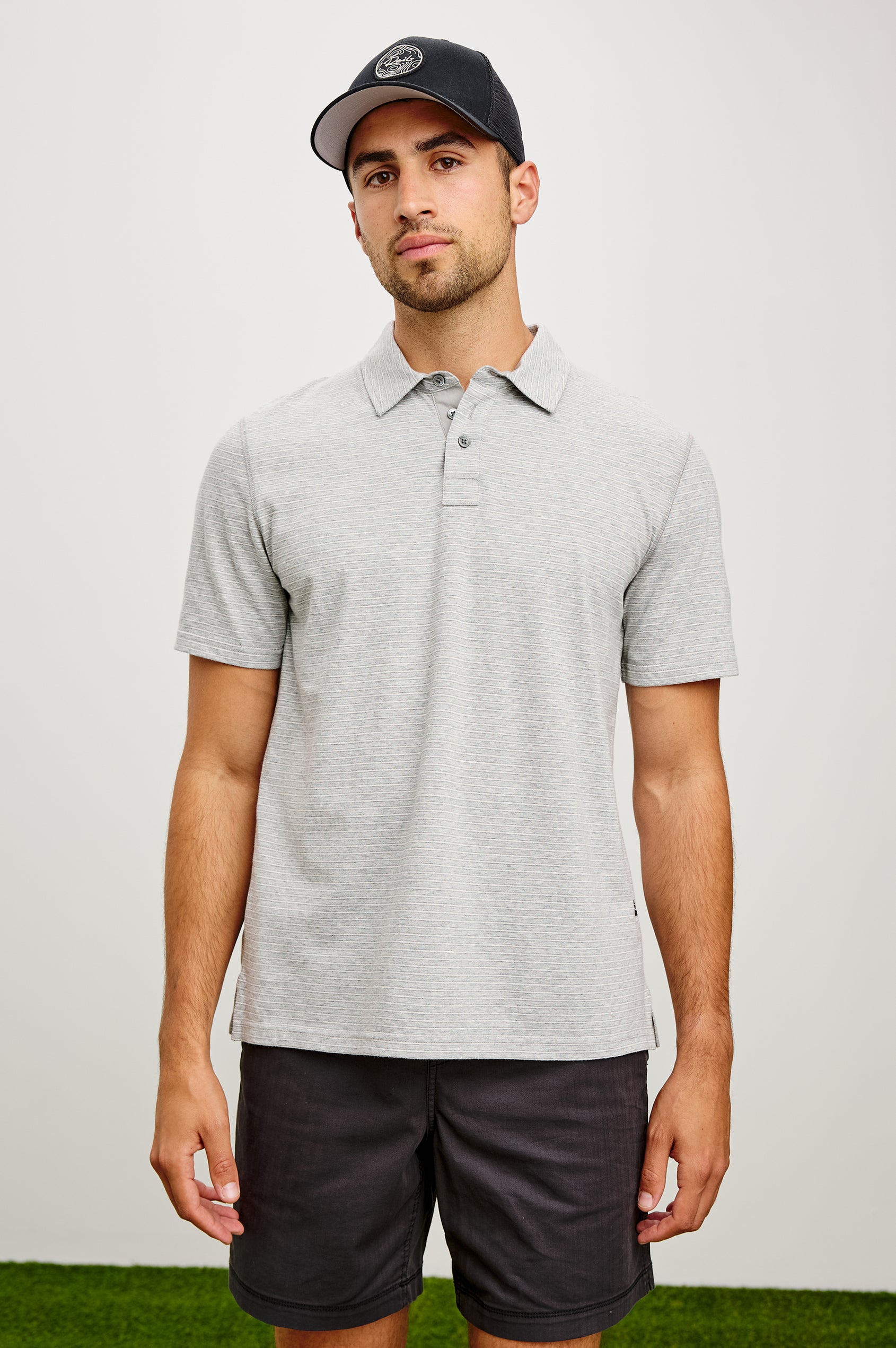 Merced Golf Polo in TENCEL™ Poly Blend With Collar, Quarter Placket, Short Sleeves, and Classic Fit in Heather Grey Stripe Colorway - Upper Body Front View Featured on Model