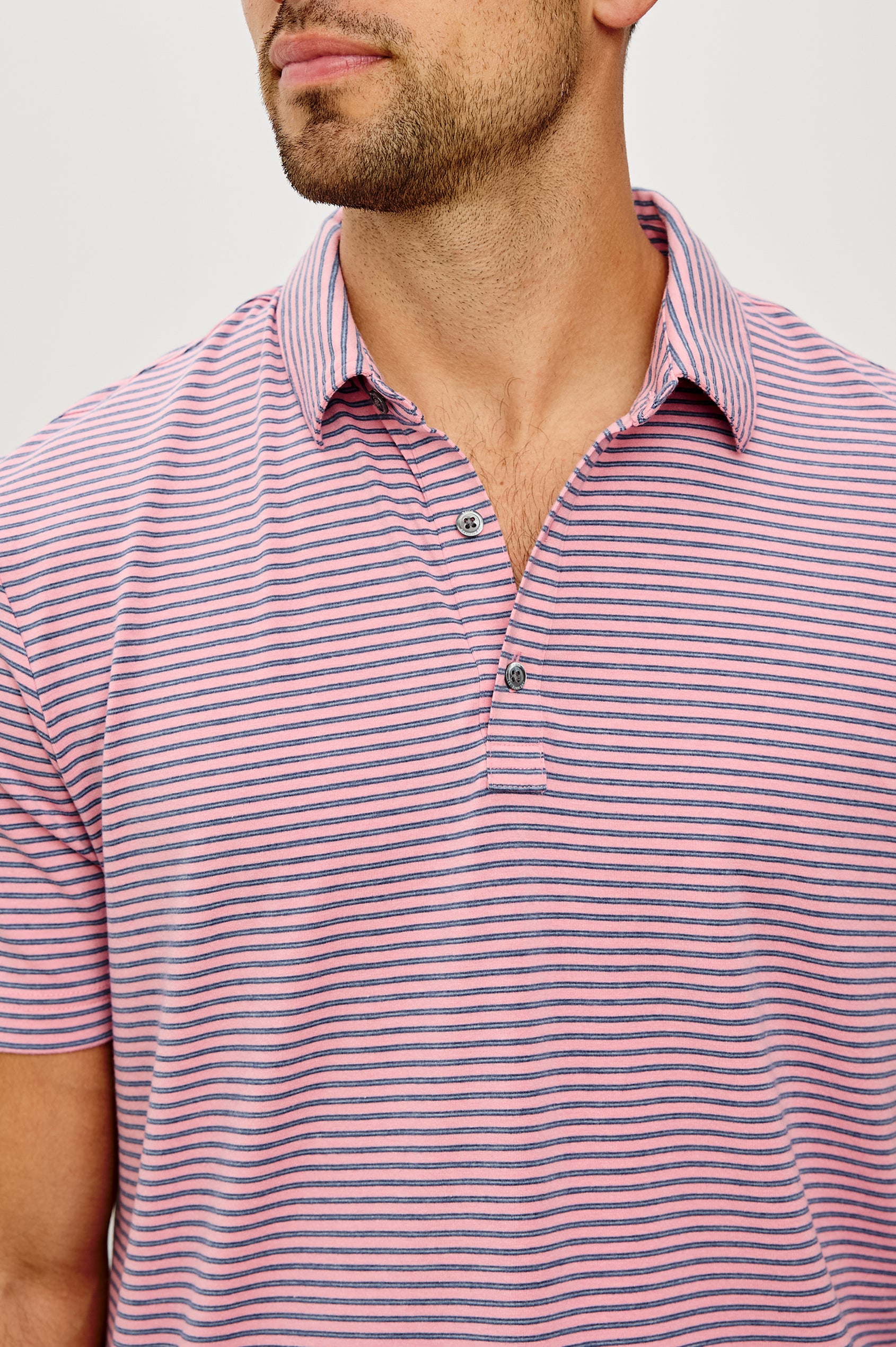 Merced Golf Polo in TENCEL™ Poly Blend With Collar, Quarter Placket, Short Sleeves, and Classic Fit in Hibiscus Mirage Stripe Colorway - Upper Body Front View Featured on Model