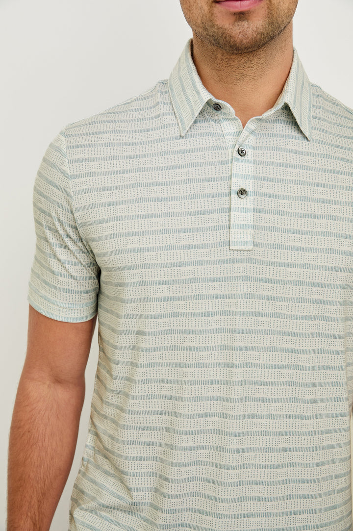Merced short sleeve athletic Golf Polo with two button placket and collar in Sashiko Border White - close up of details on model