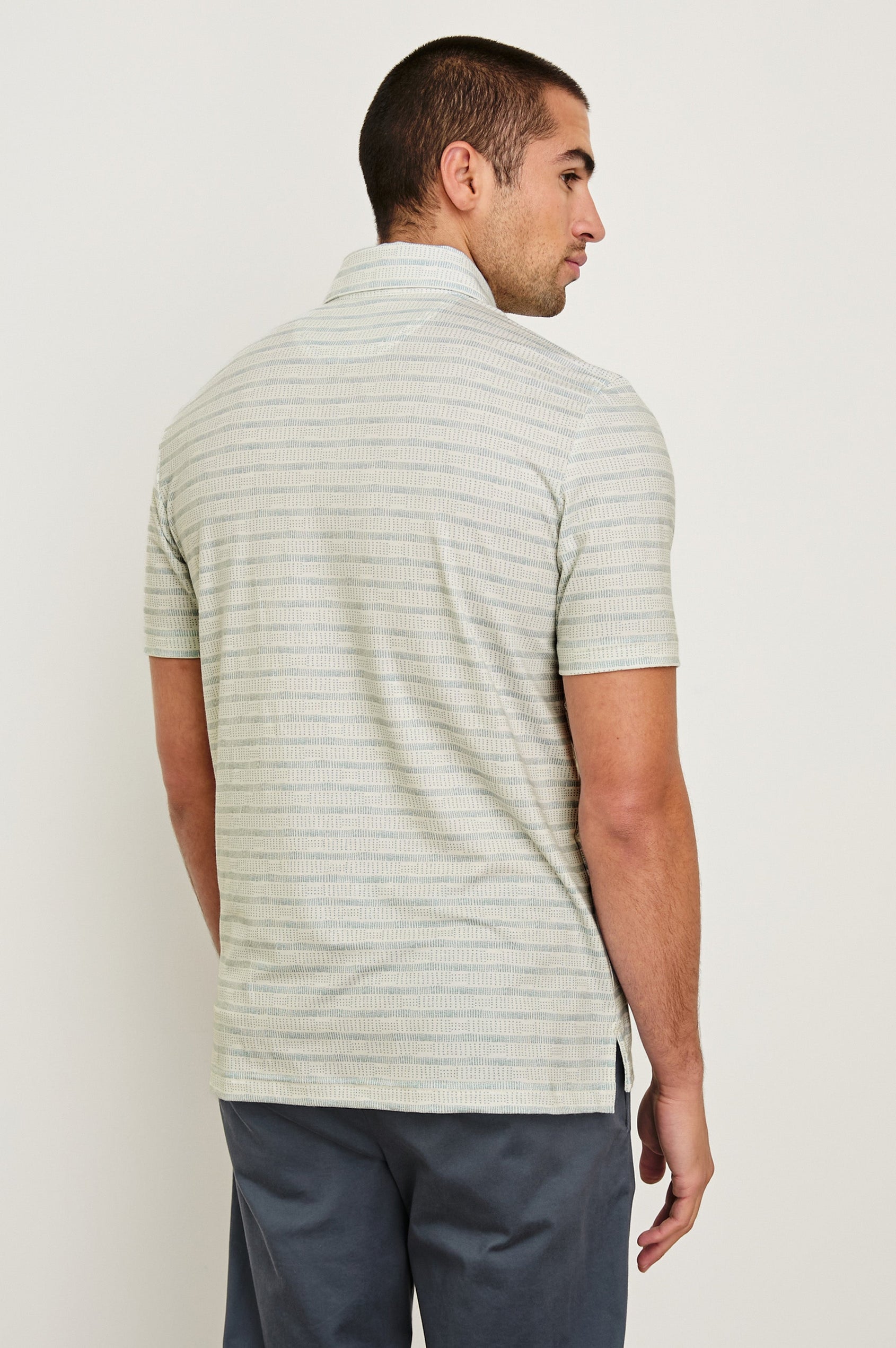 Merced short sleeve athletic Golf Polo with two button placket and collar in Sashiko Border White - back view on model