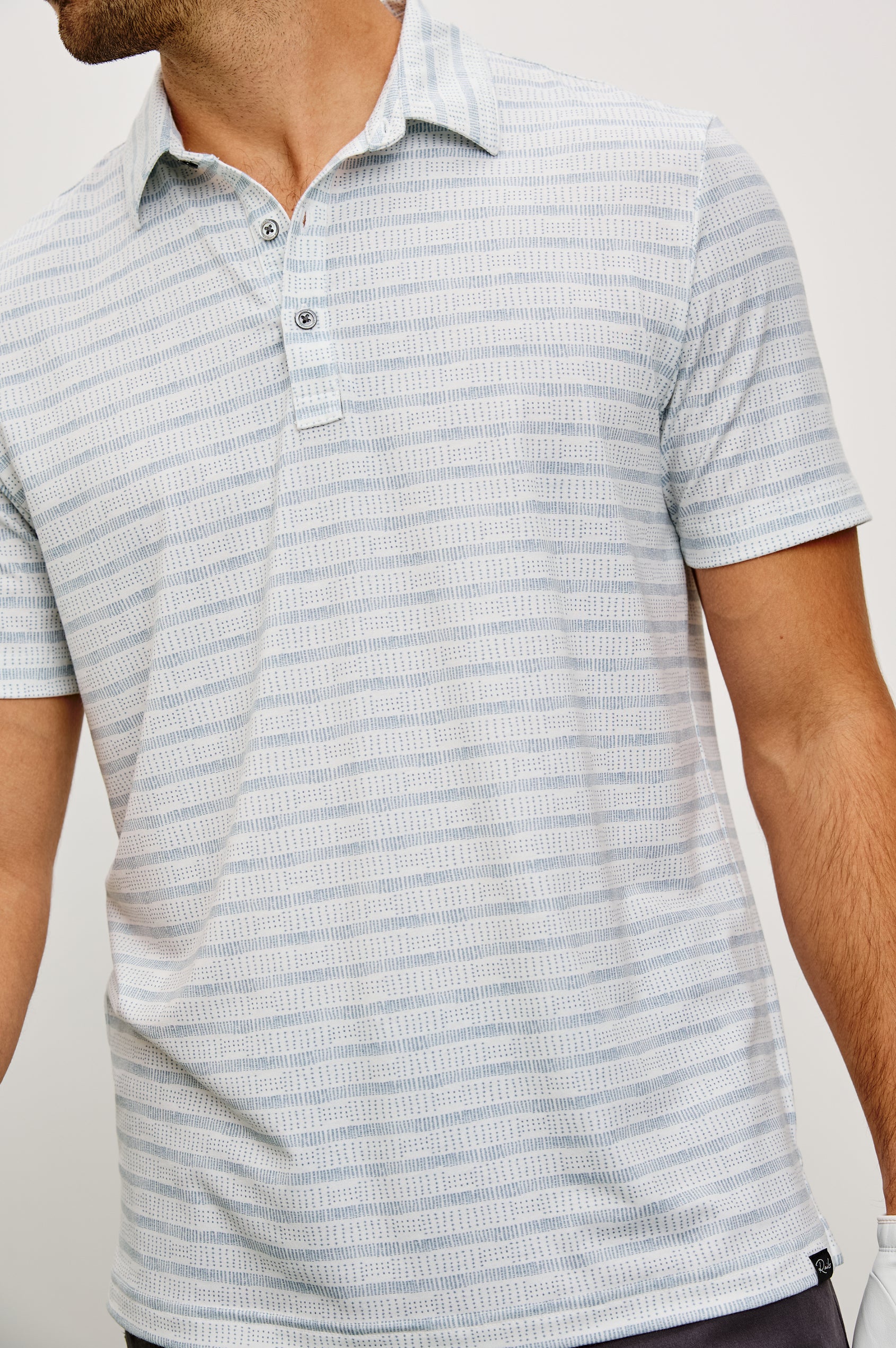 Merced Golf Polo in TENCEL™ Poly Blend With Collar, Quarter Placket, Short Sleeves, and Classic Fit in Shashiko Border White Colorway - Upper Body Front View Featured on Model