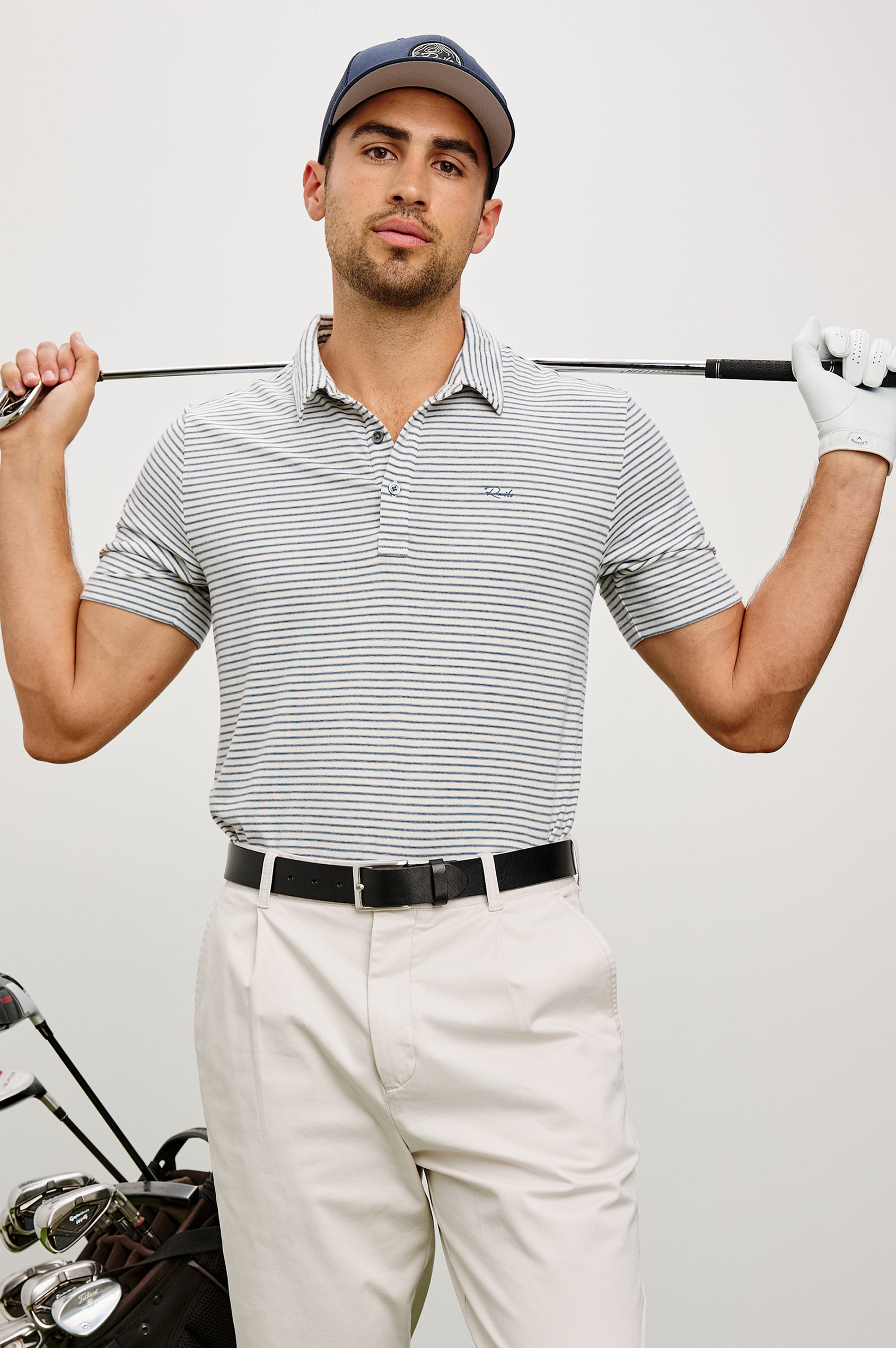 Merced Golf Polo in TENCEL™ Poly Blend With Collar, Quarter Placket, Short Sleeves, and Classic Fit in White Cosmos Stripe Colorway - Upper Body Front View Featured on Model