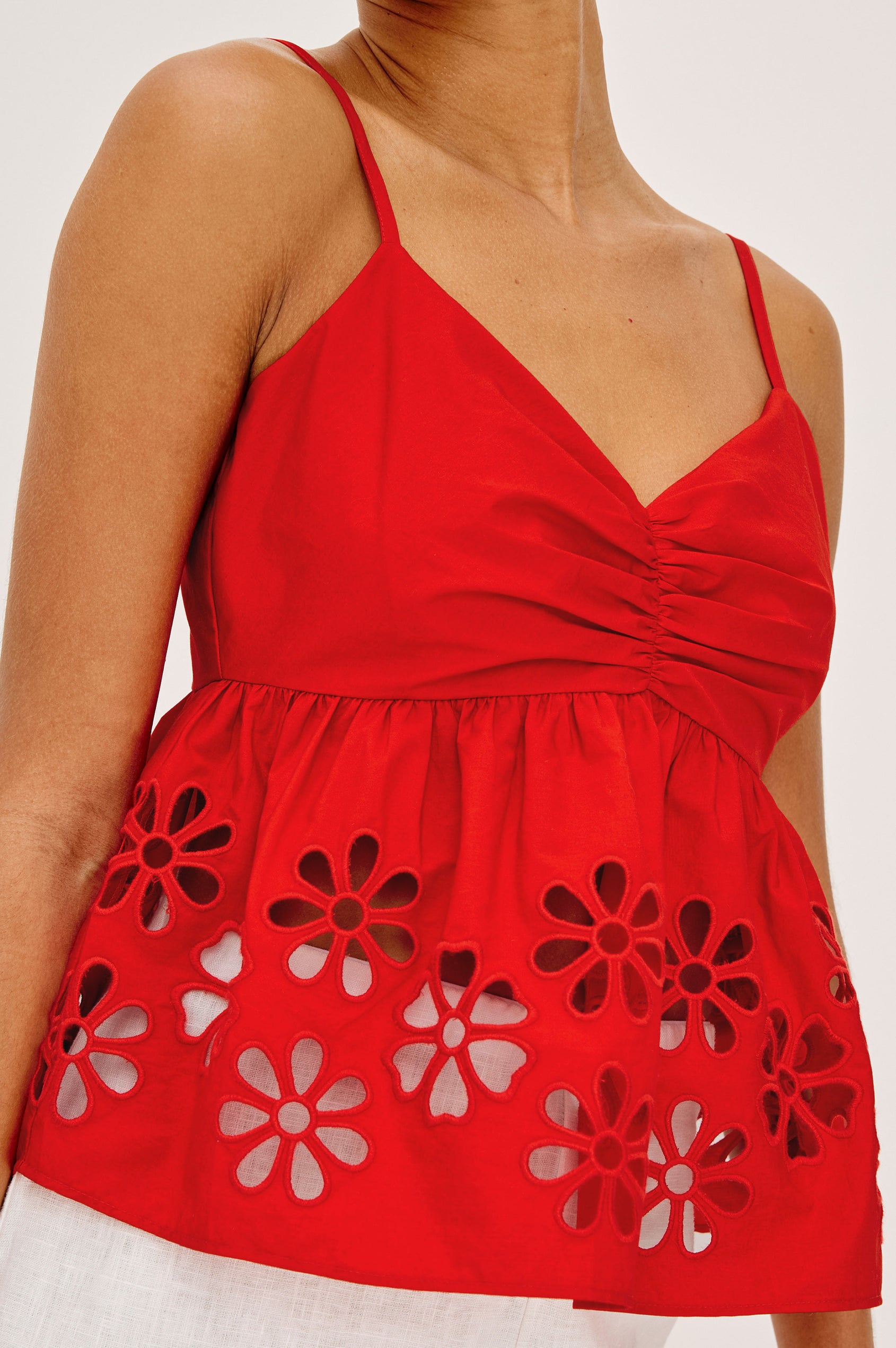 Meru Tank Top in Cotton Polin With Center Front Ruching, Peplum Embroidered Hem, and Smocked Back in Scarlet - Upper Body Close Up Front View Featured on Model