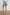 Mesa Indigo Mid Length Short with Pockets and Daisy Embroidery - On model, back lower half of body